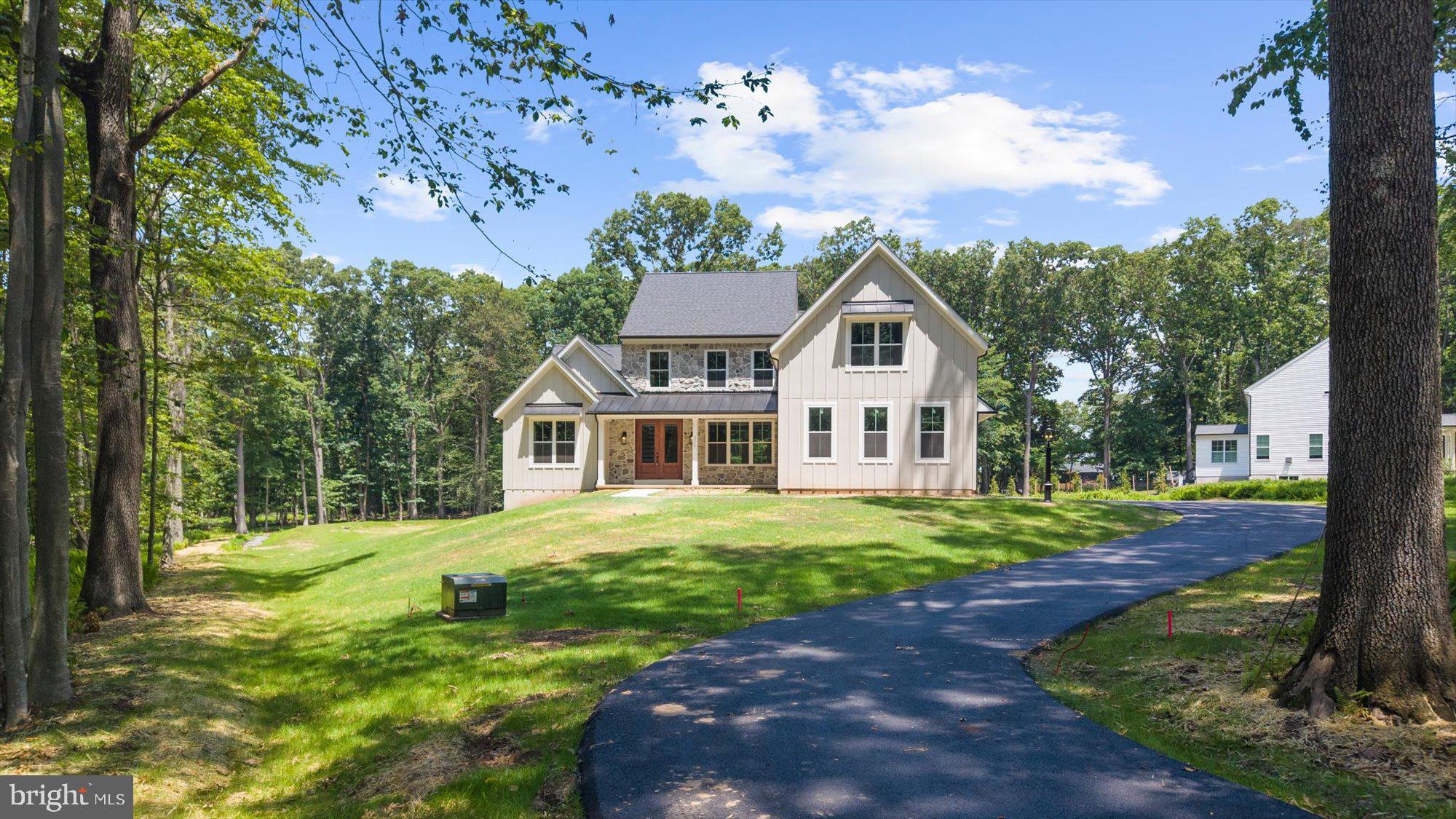 Welcome to 2075 Flint Hill Road – a stunning new-construction modern Craftsman set on 1.4 acres, blending timeless design with everyday functionality. This 4-bedroom, 2.5-bath home features a sought-after first-floor primary suite with a spa-like bath and walk-in closet, plus an open-concept kitchen with island and pantry that flows seamlessly into the great room and adjoining breakfast area/sunroom — a light-filled space perfect for casual dining, morning coffee, or enjoying peaceful views of the surrounding property year-round.

A formal dining room, mudroom/drop zone, and oversized 3-car garage add both convenience and character. Upstairs offers three spacious bedrooms, including a princess suite with private bath access, laundry room, and a large versatile flex area  and a separate private office — ideal for remote work, study, or creative space.

The walk-out basement provides excellent ceiling height and natural light, offering exceptional potential for future finished living space — whether a gym, media room, guest suite, or additional entertaining area.

Schedule your private walk-through this week to experience the craftsmanship firsthand. Located within the desirable Southern Lehigh School District. NO HOA.  MAY DELIVERY.

Grass is is AI-generated, it is still under construction. All colors, finishes, and design elements subject to builder verification.