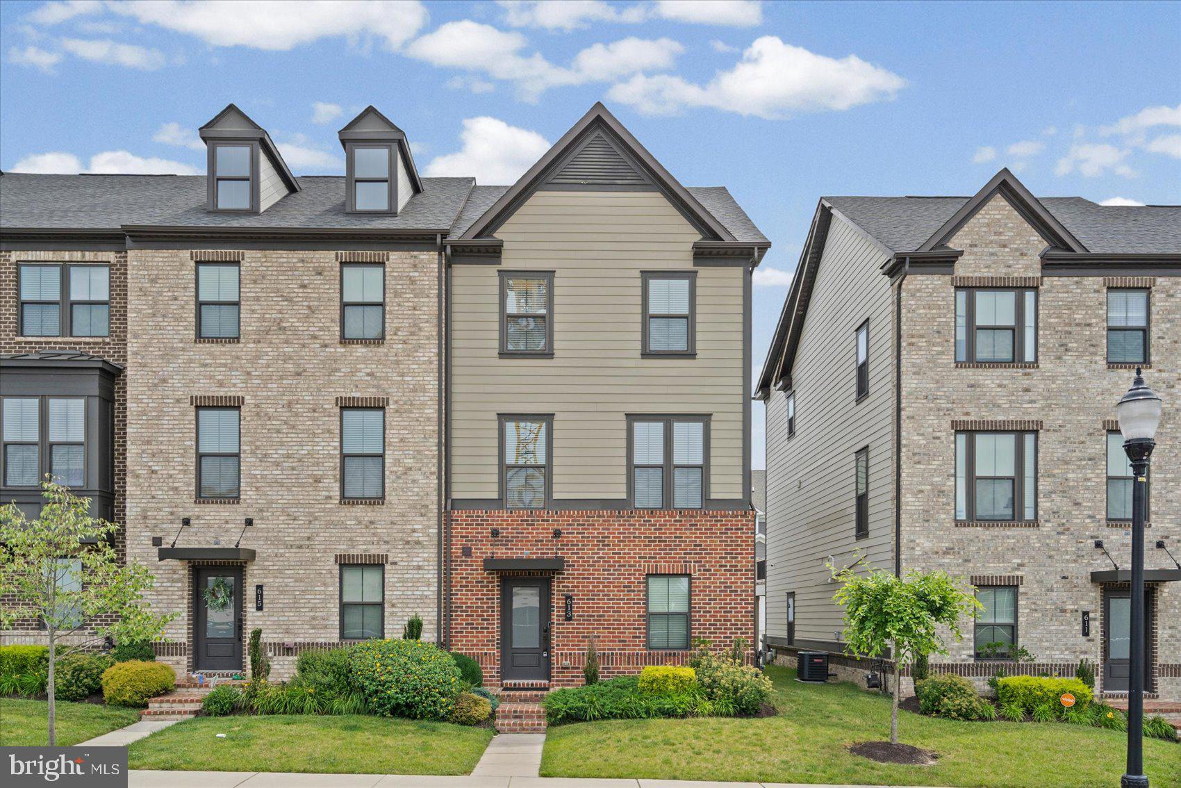 Welcome to this beautifully maintained end-unit townhome in the highly desirable Greenleigh community, where modern style, comfort, and convenience come together. Offering 3 spacious bedrooms, 2 full bathrooms, and 1 half bath, this home is thoughtfully designed for today's lifestyle.

The entry level features a versatile bonus room, perfect for a home office, fitness room, playroom, or additional living space, along with a convenient half bath, extra storage, and direct access to the attached two-car garage.

The main living level boasts beautiful hardwood flooring and an open-concept design filled with natural light. The gourmet kitchen is the heart of the home, featuring abundant cabinetry, a dedicated coffee and breakfast nook, and seamless flow into the spacious dining and living areas. Step outside onto the expansive deck, perfect for entertaining, enjoying your morning coffee, or unwinding after a long day.

Upstairs, the spacious primary suite offers a walk-in closet and a private ensuite bathroom. Two additional generously sized bedrooms, a full hall bathroom, and a conveniently located laundry area complete the upper level.

Living in Greenleigh means enjoying exceptional community amenities, including a resort-style pool, clubhouse with fitness center, multiple playgrounds, a dog park, walking trails, and beautifully maintained green spaces. Conveniently located near shopping, dining, parks, and major commuter routes, this move-in-ready home offers the perfect combination of modern living and an outstanding community lifestyle. Don't miss your opportunity to call this beautiful home your own!