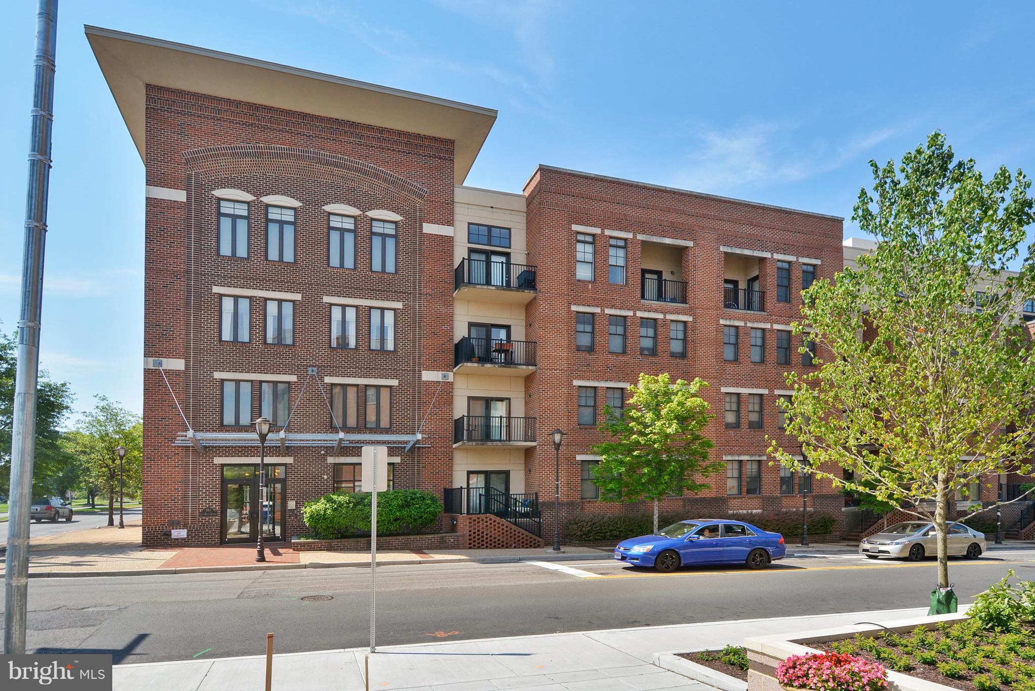 Two bedroom, two bath condo with two parking spaces at The Preston.  Open floor plan, nine foot ceilings, new wood floors and fresh neutral paint.  Granite counters and island, washer/dryer in unit, extra storage, good closet space.  Balcony faces south.  Very conveniently located near Potomac Yards, National Airport, Del Ray and Old Town. 1.4 miles to Metro. Walk to retail and restaurants.