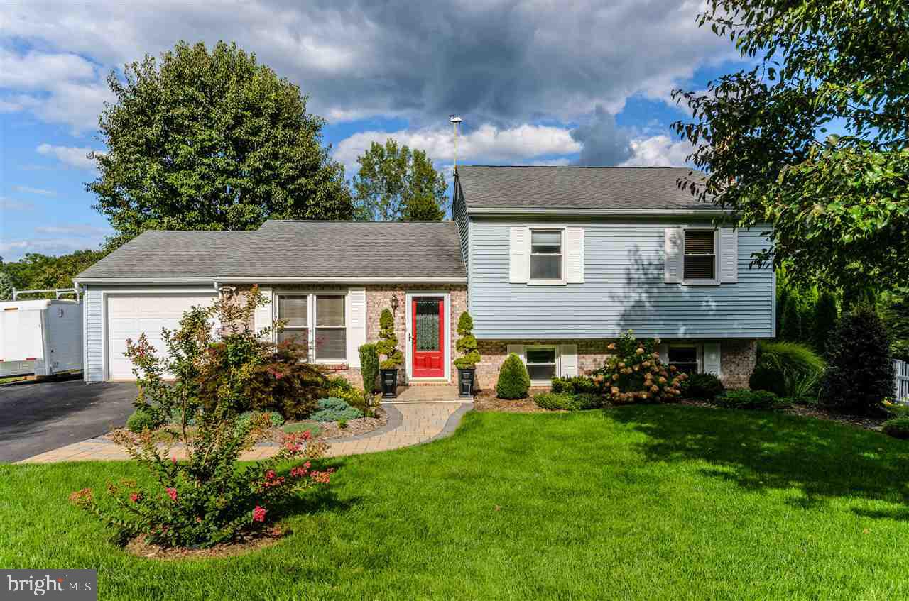 Immaculate, nicely landscaped 3 bd/2 ba split level in Dallastown Schools.  Close to Lake Redman Park, Dallastown Middle & High Schools as well as shops and restaurants!  Enjoy entertaining on the deck, or relaxing on the patio listening to the waterfall feature.  Offering 2 updated full baths, as well as an updated kitchen, and all appliances included!  Lower level has a cozy family room w/ a toasty coal stove, as well as full bath. A real gem!