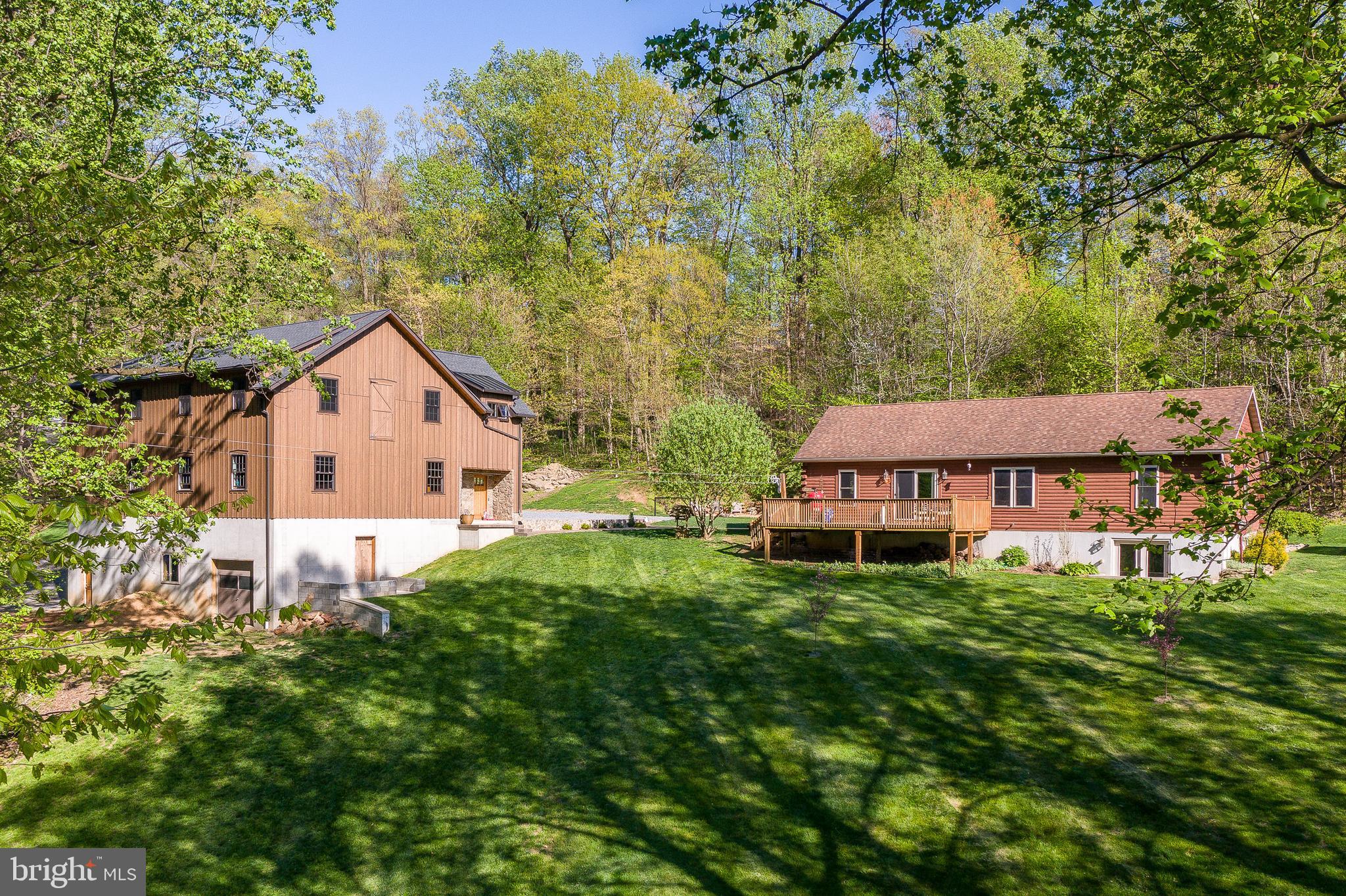 This property is going to onsite auction 6/3/2026 at 6:00 p.m. and is being sold with reserve. LISTED PRICE IS ONLY A SUGGESTED OPENING BID AND IS NOT INDICATIVE OF THE FINAL SALES PRICE WHICH WILL BE BY SELLER CONFIRMATION DAY OF AUCTION. Terms: Property Sold As-Is, 10% deposit day of sale, buyer pays 2% transfer tax, settlement within 90 days of auction.

Home Features 
2BR, 2 Full BA – Approx. 2.95 AC
Total Residence approx. 3,328 sq ft.
Built 2008
Single Story Ranch Log Cabin
Large Family Room
Sliding Glass Doors Opening to Side Deck
Unfinished Walk Out Basement
Private Wooded Lot
Developed Garden
Potting Shed/Greenhouse
Propane Furnace
Forced Air Heat
Central Air

OUTBUILDING 
3 Story Barn Built in 2023
Main Level Carriage Garage with 4 Stalls
Lower level is Open for Workshop/Storage
Oversized Garage Door Access with High Ceilings
Third Floor is a Large Rec Area with Office in Corner
200 Amp Electrical Service