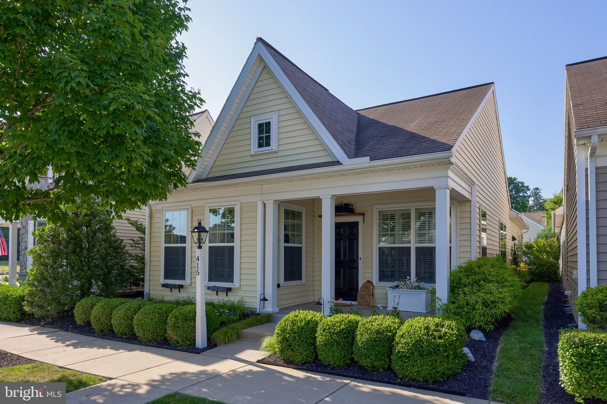 Welcome to low-maintenance living in the heart of Heritage Strasburg! Nestled on tree-lined streets with charming cobblestone curbing, this beautiful ranch home offers the perfect blend of tranquility and convenience. Enjoy a peaceful, quiet setting while being just minutes from major highways, premier shopping, dining, and all the amenities you need.

Step onto the covered front porch and into a sun-drenched living space featuring 9-foot ceilings that flow throughout the entire home. The light, neutral color palette and tall windows with custom Hunter Douglas plantation shutters and blinds create a bright, airy atmosphere that feels both elegant and welcoming.

Flanking the living room are two generously sized bedrooms, perfect for guests or easily convertible to a home office, den, or hobby room, and these share a beautifully updated main bathroom boasting new flooring, a stylish new vanity, and modern light and plumbing fixtures.

The heart of the home is the spacious kitchen, equipped with sleek black stainless-steel appliances, abundant counter space, a convenient breakfast bar, under-cabinet lighting, and ample pantry storage. The adjoining dining area is flooded with natural light and offers plenty of room for a large dining set, ideal for hosting family and friends.

Retreat to the expansive Owner's Suite, which features two closets, including a deep walk-in, and a private en-suite bath. The spa-like bath showcases a granite-topped vanity, updated lighting, fixtures, new flooring, and a large glass-enclosed shower.

Through the patio doors off the dining area, step out to your cozy, private patio, the perfect spot for shaded summer evenings, morning coffee, or quiet relaxation. The spacious two-car garage offers tons of storage space plus attic access for even more room.

There is nothing "builder grade" about this home; it has been thoughtfully updated throughout with high-end finishes and incredible attention to detail. Living in Heritage Strasburg offers you a turnkey lifestyle, with the HOA covering all lawn care, landscaping maintenance, snow removal, and even contributing to a roof replacement fund, so you can truly lock-and-leave. Don't miss this rare opportunity to own a meticulously cared-for home in one of the area's most sought-after 55+ communities.