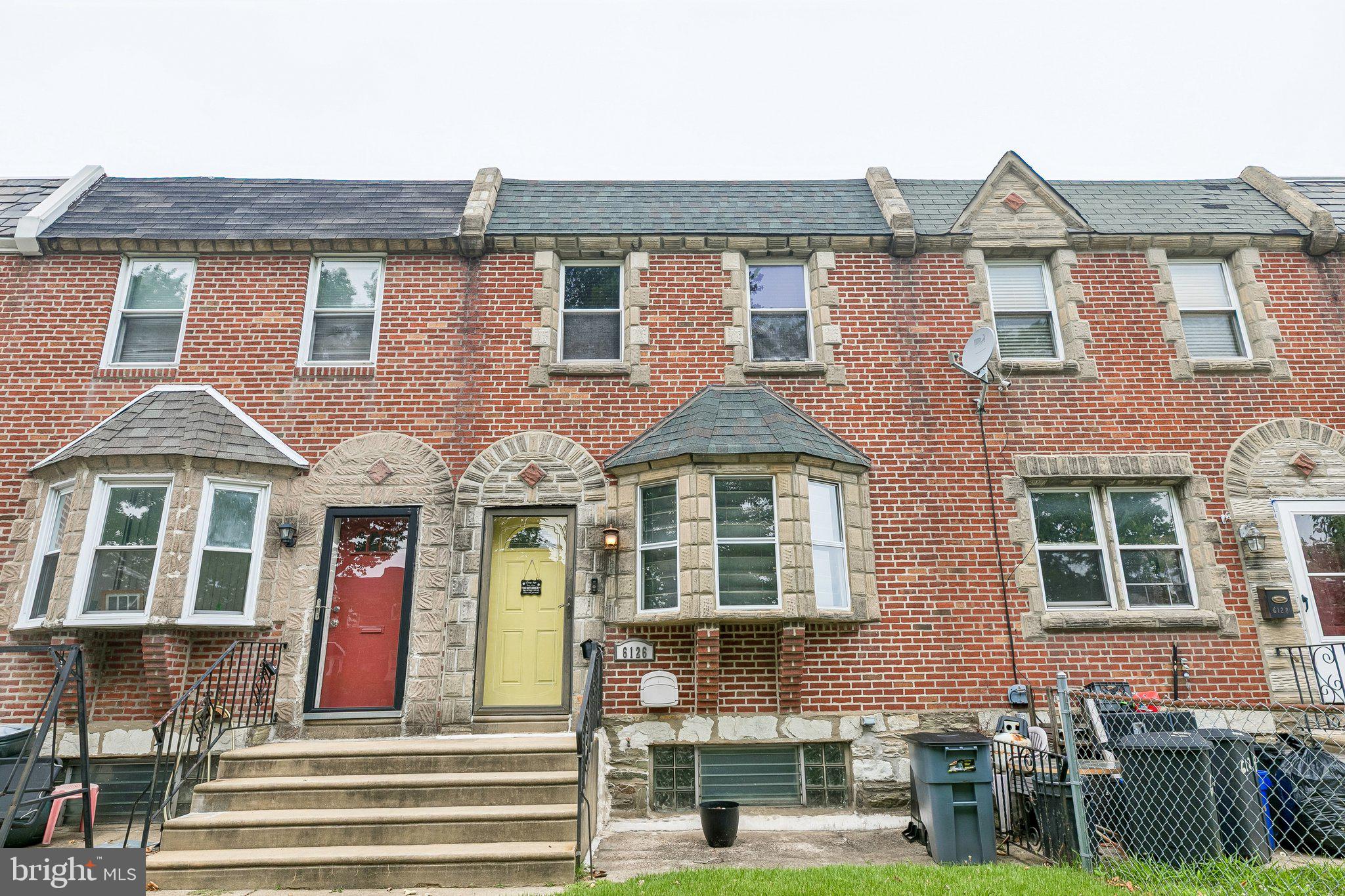 Welcome to 6126 Mulberry Street, a beautifully updated, move-in-ready brick row home nestled in Philadelphia’s desirable Wissinoming neighborhood. Offering 2 bedrooms, 1.5 bathrooms, and 1,088 square feet of thoughtfully designed living space, this home perfectly blends classic Philly architecture with high-end modern amenities. Step past the welcoming yellow front door into a bright, airy living and dining space featuring recessed lighting and gorgeous flooring. The seamless transition from the living room to the dining area makes it an ideal layout for both daily living and entertaining. The fully modernized kitchen is a home cook’s dream, boasting sleek white cabinetry paired with dark granite countertops. A stylish tile backsplash and durable tile flooring. Stainless steel appliances, including a full-size French door refrigerator, built-in microwave, dishwasher, and gas stove/range. A built-in wine fridge and a breakfast bar peninsula perfect for morning coffee or casual meal prep. Upstairs, you'll find two comfortable bedrooms featuring durable laminate wood flooring, updated ceiling fans, and excellent closet space—including a primary bedroom complete with a rustic sliding barn door and built-in wardrobe storage. The crown jewel of the second floor is the massive, ultra-luxurious primary bathroom. Soak your worries away under the stars thanks to a stunning overhead skylight, a deep jetted soaking tub, and a massive, custom glass-enclosed tile shower equipped with a built-in bench. Need more space? The fully finished lower level offers the perfect footprint for a cozy family room, home office, or gym. It features neat drop ceilings, recessed lighting, soft carpeting, and a wall of built-in closets for seamless storage, plus a separate utility and laundry area. Skip the Philly parking headache! This property includes highly coveted 2-car rear parking situated right beneath your massive raised wooden rear deck. Fenced for privacy, the deck serves as the ultimate outdoor retreat for summer BBQs, container gardening, or just lounging on outdoor sofas. All square footage numbers are approximate and should be verified by the buyer. It is the responsibility of the buyer to verify real estate taxes.