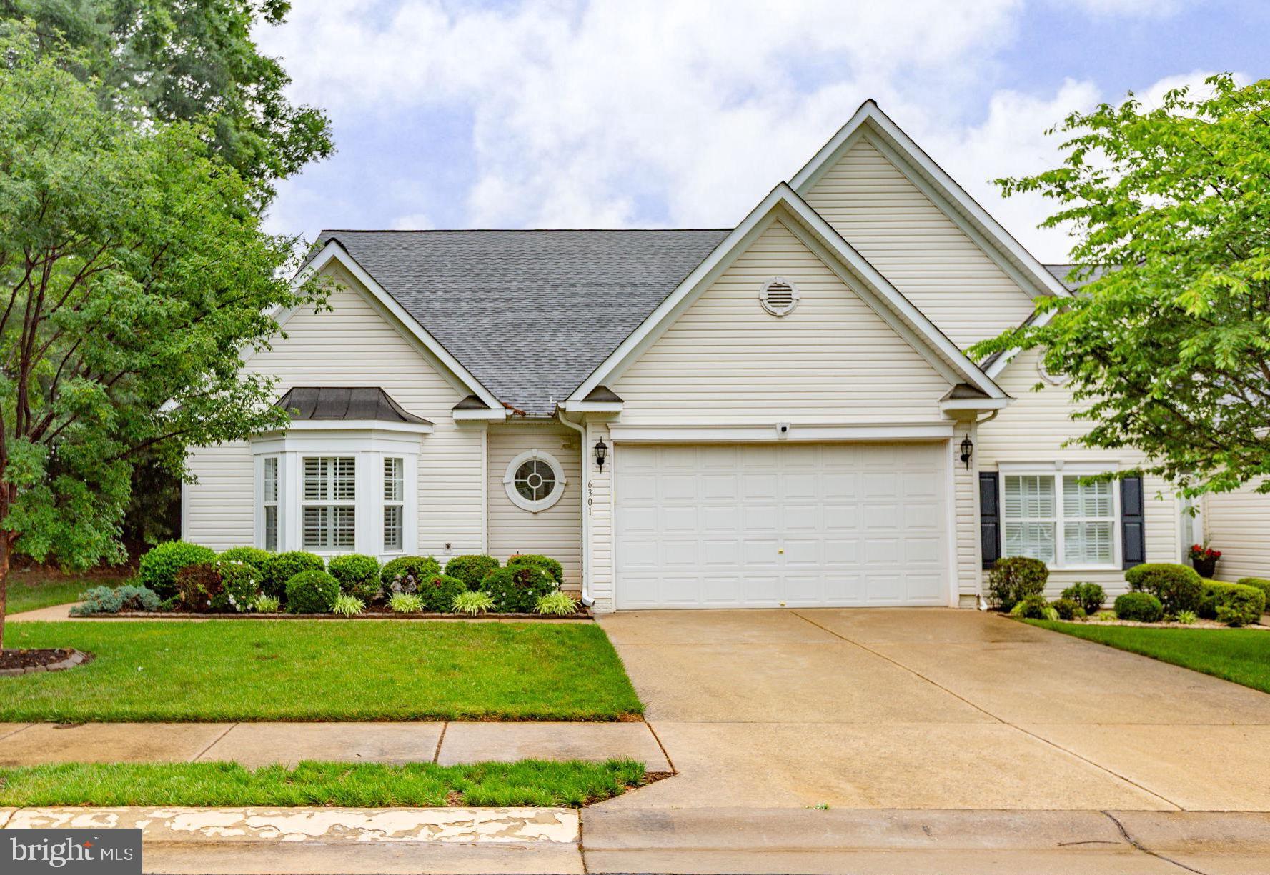 Tucked within a sought-after 55+ community, this beautifully designed Cape Cod-style residence is such a rare offering! Homes here are seldom available, making this an exceptional opportunity to enjoy low-maintenance living in a truly fabulous location, without the exorbitant HOA fees so often found in similar active adult communities. From the moment you step inside, the architectural detail and thoughtful upgrades set this home apart. Extensive crown moulding, chair rail accents, decorative columns, and timeless finishes create an elegant yet welcoming feel throughout. The main-level primary suite offers both comfort and convenience, complete with a spacious walk-in closet and spa-inspired bath designed for relaxation. At the heart of the home, the expansive family room with a cozy gas fireplace flows seamlessly into a chef’s kitchen that was made for entertaining. Gas cooking, abundant cabinetry, generous prep space, and a massive breakfast bar make this kitchen as functional as it is beautiful. Whether hosting gatherings or enjoying quiet mornings at home, the layout lives exceptionally well. Upstairs, an additional family room provides flexible living space for guests, hobbies, or movie nights, while the incredible craft room is truly a dream setup for creativity and organization. Outdoor living is just as impressive. The oversized patio with its beautiful awning creates the perfect backdrop for dining al fresco, relaxing with coffee, or enjoying evenings outdoors. Even better? The community takes care of the lawn maintenance, allowing you more time to enjoy the lifestyle this wonderful neighborhood offers. Elegant, spacious, and a location hard to find, this is 55+ living at its very best.