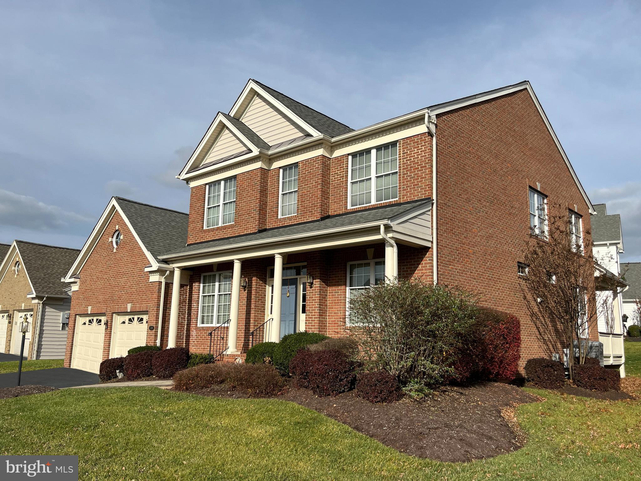 Court Ordered Bankruptcy Sale.  Priced to Sell.  Stately Toll Brothers "Tradition" floor plan on corner lot in the Regency (55+) at Dominion Valley!  Built in 2005, this is among the largest models they offered, boasting 3,070 finished sq ft on the top two floors, PLUS a huge basement with another 2,162 sq ft just waiting to be finished into your dream retreat!  This home was built with luxurious upgrades like a covered brick porch, hardwood floors, decorative columns, tray ceilings, crown and chair moldings, and an open, gourmet kitchen with granite countertops and stainless appliances.  New kitchen appliances in last 3-4 years including stainless steel refrigerator with bottom drawers, stainless double wall ovens, built-in microwave, and gas cooktop!  (Dishwasher is 10 years old.)  Main level living with the Owners' Suite (primary bedroom, primary bathroom, and walk-in closet) in the rear corner of the house, plus Bedroom 2 and another full bathroom beside it.  Upstairs you'll find a loft overlooking the two-story family room, Bedroom 3, a full bathroom, and BR4/den (no closet).  The lower level has a fourth finished full bathroom plus plenty of unfinished space.   Relax out back under the covered porch or step down from the Trex deck onto the rear brick paver patio.  High tech features include two-zone HVAC with high-efficiency gas furnace and heat pumps, hybrid water heater, and air purifiers, plus inground irrigation system, and a gas pipe for your grill on the rear deck.  Regency at Dominion Valley is a premier active adult (55+) gated community just 35 miles west of Washington, D.C.  The focal point of this resort-style community is a magnificent 30,000 square foot clubhouse loaded with amenities and recreational opportunities.  The winner of the 2014 Washington Metropolitan Chapter Community Associations Institute's "Community of the Year" Award, Regency features beautiful homes, open spaces, and mountain views.  The Clubhouse (within walking distance!) boasts excellent indoor and outdoor dining facilities, with areas for weddings, banquets, parties, and meetings.  Residents can enjoy an indoor heated pool and spa, state-of-the art fitness center, and an aerobics and exercise studio.  Outdoor recreation includes another swimming pool, lighted tennis and pickleball courts, walking and biking trails, and easy access to community parks, lakes, and ponds.  Comcast Xfinity high-speed internet and basic cable TV is included in the $371 monthly HOA fee ($2,066 one-time capital contribution).  A Dominion Valley Social Membership fee is required for all homeowners ($62 monthly with a $1,000 initiation fee).  This home needs cosmetic refreshing to restore its original glory and is priced accordingly (priced well below recent comps, including smaller homes).