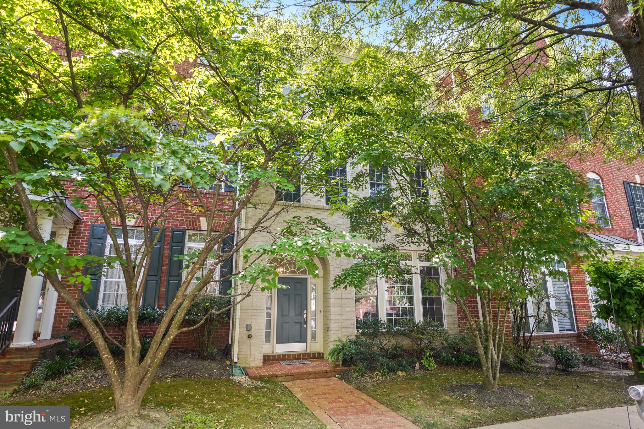 Welcome to this beautifully updated 3-level townhouse in the highly desirable King Farm community, offering 4 bedrooms, 3 full baths, 1 half bath, and a detached 2-car garage. Ideally located with easy access to the Metro, shopping, dining, and major commuter routes, this exceptional home also offers access to outstanding community amenities, including an outdoor swimming pool, parks, walking trails, and more. Thoughtfully upgraded throughout, this home combines timeless style with modern convenience. The main level features hardwood flooring in the living and dining rooms, while the kitchen, family room, and foyer showcase durable ceramic tile flooring. The refreshed kitchen offers granite counter-tops, upgraded appliances, updated cabinetry, and a spacious breakfast area that can also serve as a dining space, allowing the formal dining room to be used as a home office if desired. Custom built-ins enhance the family room, and new lighting and a ceiling fan complete the inviting main level. Upstairs, the second level continues with hardwood flooring and features an impressive primary suite with three closets, including two walk-in closets. The luxurious primary bathroom was completely renovated in 2022 and offers spa-inspired finishes, including a seamless glass walk-in shower, elegant soaking tub, double vanity, and custom cabinetry. The third level provides two generously sized bedrooms, a beautifully renovated full bathroom (2025), and a versatile recreation area ideal for a media room, playroom, home office, or guest retreat. Additional improvements include a new roof (2023), water heater (2025), renovated secondary full bathrooms (2025), LED ceiling lighting (2023), custom closet systems (2022), updated interior door hardware (2022), and an insulated garage door (2022). The detached garage also features a custom workbench and built-in storage shelving for exceptional organization. Step outside to enjoy the beautifully landscaped private patio nestled between the home and garage—an ideal setting for outdoor dining, entertaining, or simply relaxing. With its extensive updates, flexible floor plan, abundant storage, and prime King Farm location, this move-in ready home offers the perfect combination of comfort, style, and convenience.