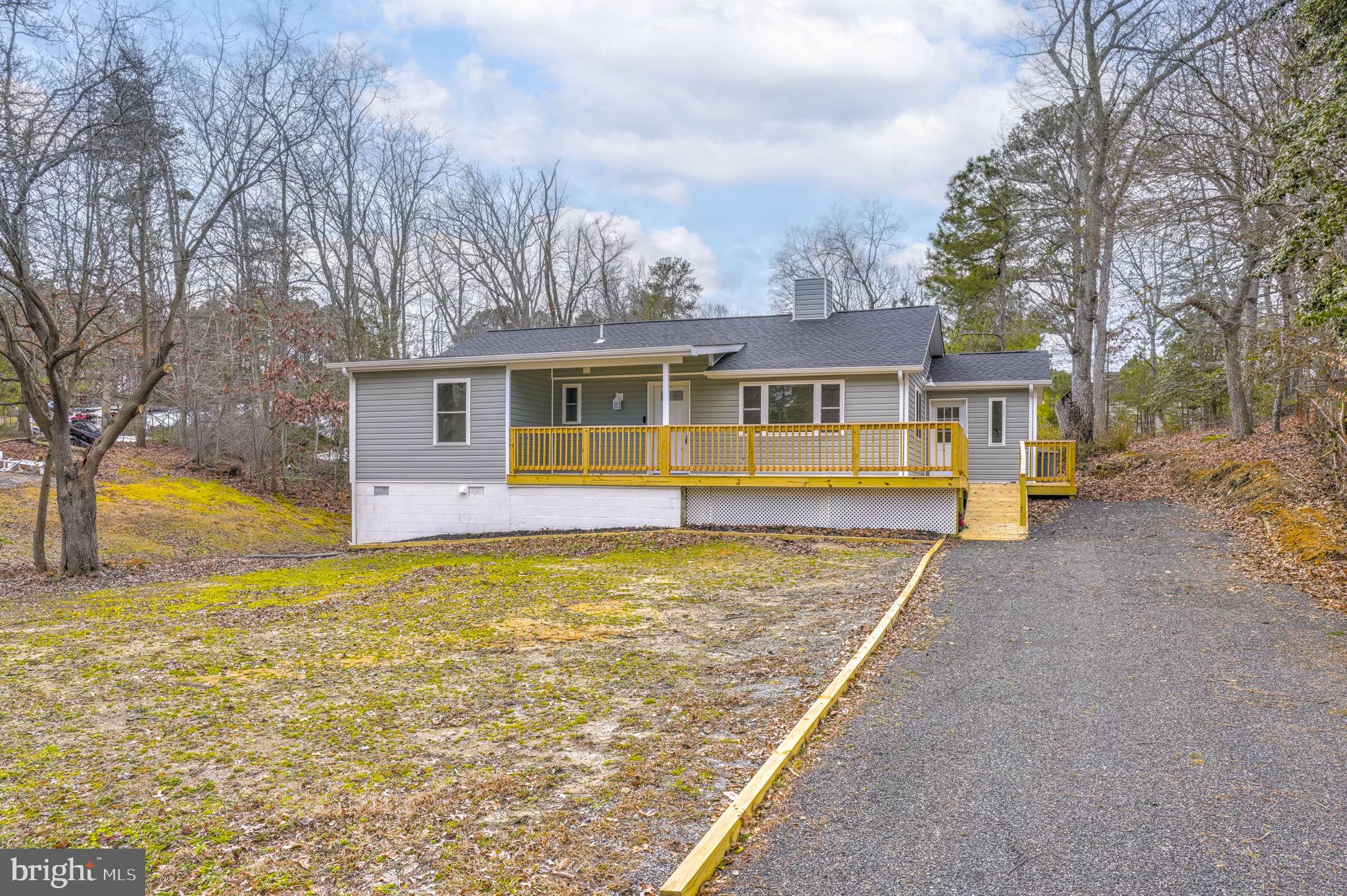 TURNKEY COASTAL LIVING: FULLY RENOVATED HOME NEAR CHESAPEAKE BAY WITH NO HOA

Experience coastal lifestyle and modern luxury in this completely renovated, move-in-ready single-family home. Situated on a generous 0.66-acre lot with no HOA restrictions, this property offers rare privacy, space, and freedom—all just a short walk from the beautiful Chesapeake Bay and popular local dining.

SPACIOUS INTERIOR & FLEXIBLE LIVING SPACE
Designed with a seamless flow, this 3-bedroom, 2-bathroom home features a beautifully modernized interior. The heart of the home is a stunning new kitchen with upgraded cabinetry, stylish countertops, and brand-new appliances. The home boasts fresh paint and luxury waterproof LVP flooring, leading to fully renovated bathrooms with contemporary finishes.

The full walkout basement adds massive value and flexibility. This unfinished lower level serves as a blank canvas, perfectly suited for a future accessory apartment, home office, private gym, or expansive recreation room.

TOP-TO-BOTTOM PREMIUM UPDATES
Enjoy total peace of mind with every major structural component and system brand new. High-efficiency upgrades include:

New Mechanicals: Complete HVAC system, new insulation, and energy-efficient double-pane windows.

Exterior Enhancements: New roof, gutters, and siding.

Curb Appeal & Security: Upgraded front door with stained glass, a smart video doorbell with remote access, and a new wood wraparound front deck.

OUTDOOR OASIS IN A QUIET NEIGHBORHOOD
The expansive over-half-acre yard provides a peaceful, quiet retreat with endless possibilities for outdoor entertaining, gardening, or relaxing.

If you are searching for a fully updated, modern home near the water with a large yard and total freedom from HOA rules, this Chesapeake Bay gem is completely turnkey and ready for you.