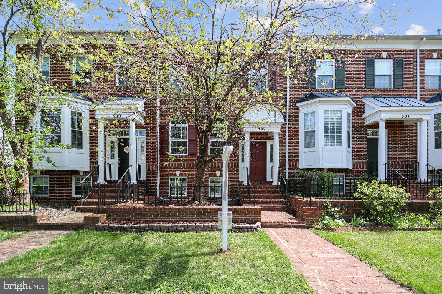 Remodeled 3BR/3.5BA brick-front townhouse with 2-car garage, RARE fourth-level loft bedroom suite, and tons of natural light. Built in 2000, this model spans approximately 2,400 square feet on four levels including: 9-foot ceilings;  hardwood floors on entire main level; designer stamped pattern carpeting in all bedrooms on upper levels; 12-inch ceramic tile flooring in lower level; ceramic tile floors in all bathrooms; new custom painting throughout; new door hardware; detailed two and three-piece crown, chair rail & shadow box molding; recessed and upgraded lighting; and two-inch wood blinds throughout.  Brick lead walk to brick stoop and covered portico front entrance; hardwood foyer with chandelier; living room/dining room combination; powder room with pedestal sink; gourmet kitchen with 42-inch white cabinets, Colonial White granite countertops, stainless appliances, recessed lighting, and center island with breakfast bar; breakfast area with French doors to deck and vinyl rails; family room off kitchen with corner gas FP and slate surround; primary bedroom suite with ceiling fan, walk-in closet, and Super bath with Jacuzzi whirlpool tub with ceramic tile tub deck, and separate walk-in ceramic tiled shower; second bedroom  with cathedral ceiling and ensuite bath; BONUS fourth level bedroom suite with ceiling fan, double-door closet, and en suite ceramic tile full bath; upstairs hallway with laundry room; lower level recreation room with 12-inch ceramic tile floors, full daylight windows, and huge walk-in closet/luggage storage; access to 2-car garage from lower level opens to driveway for two cars.  Right in the heart of everything that King Farm has to offer...only a few blocks to the community pool, steps to multiple parks and fields, across the street from King Farm Village Center shopping, and nearby the courtesy King Farm shuttle stop to Shady Grove Metro.