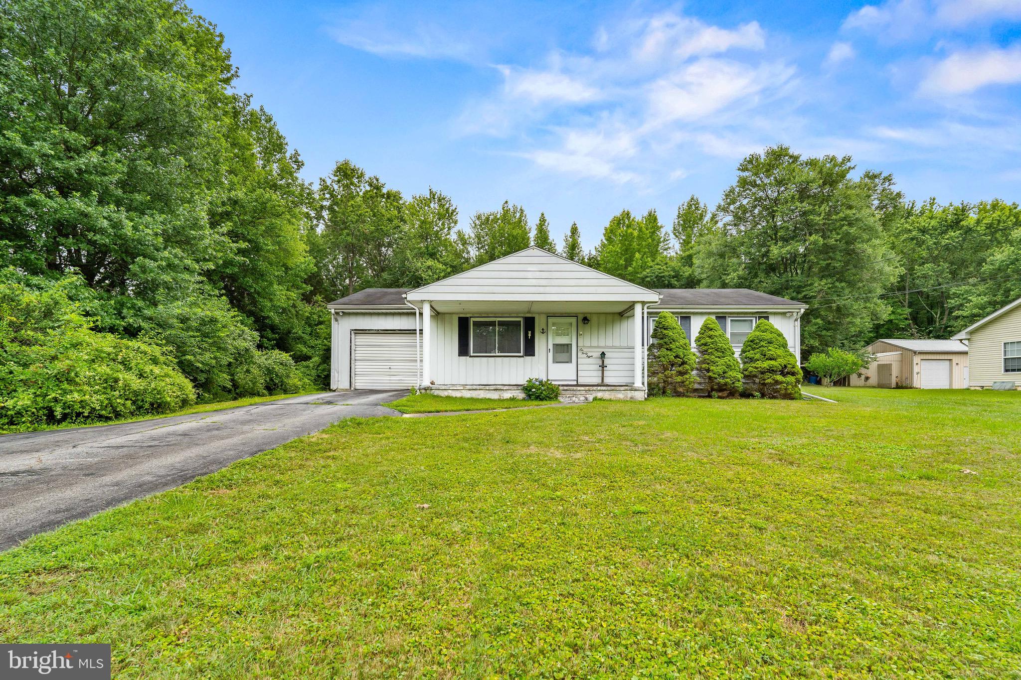 Endless potential awaits in this charming 3 BR ranch, perfectly situated on nearly an acre with no HOA! Bring your vision and creativity to add your personal touch while building equity! Features include a large yard with mature landscaping, attached garage, hardwood flooring throughout, a newer roof and a new oil-fired boiler with baseboard heat. The basement includes washer and dryer hookups. Outside, a storage shed with cement flooring and built-in shelves provides even more room for tools and equipment. Conveniently located just minutes from shopping, dining, schools and major commuting routes, this property combines a desirable location with incredible potential. The price reflects the home's need for some work. No interior photos are available at the seller's request due to personal belongings.