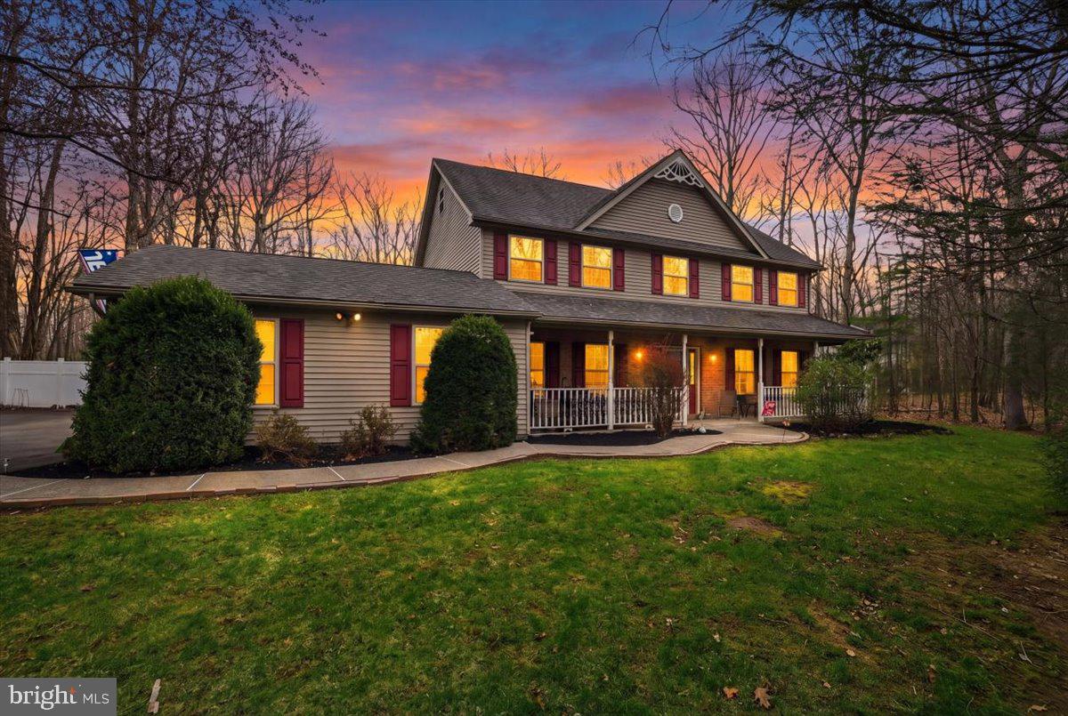 Welcome to your dream home nestled in the charming Pocono Laurel Lake area of East Stroudsburg, Pennsylvania. This exquisite Colonial-inspired two-story suburban traditional-style home, located in the coveted “The Woodlands” section, offers the perfect blend of elegance and functionality.

As you step inside, you'll be greeted by a formal living room that exudes timeless charm. The spacious family room provides a cozy retreat, perfect for gatherings with loved ones. Adjacent, the dining area seamlessly connects to an updated kitchen featuring sleek stainless steel appliances, making it a chef's delight. Sunlight pours into the inviting sunroom—a haven for relaxation throughout the seasons.

The ground level also boasts a versatile bonus room, easily convertible into a guest suite or a ground-floor bedroom, alongside a convenient laundry room and full bathroom.

Ascending to the second level, you'll find three generously sized bedrooms, each designed with comfort in mind, and a common bathroom. The primary suite is a true sanctuary, featuring a walk-in closet and an ensuite bathroom, offering the ultimate retreat after a long day.

The third level presents a canvas for your imagination with an additional bonus room—ideal for a game or movie room—and an unfinished attic, providing ample storage space.

For car enthusiasts, this home offers three garages, with two attached directly to the home, providing convenience and security.

Step outside to discover a spacious backyard, perfect for outdoor entertainment and creating lasting memories with family and friends.

This home is more than just a place to live; it's a lifestyle. Don’t miss the opportunity to make it yours. Schedule a viewing today and experience the allure and comfort this beautiful property has to offer.