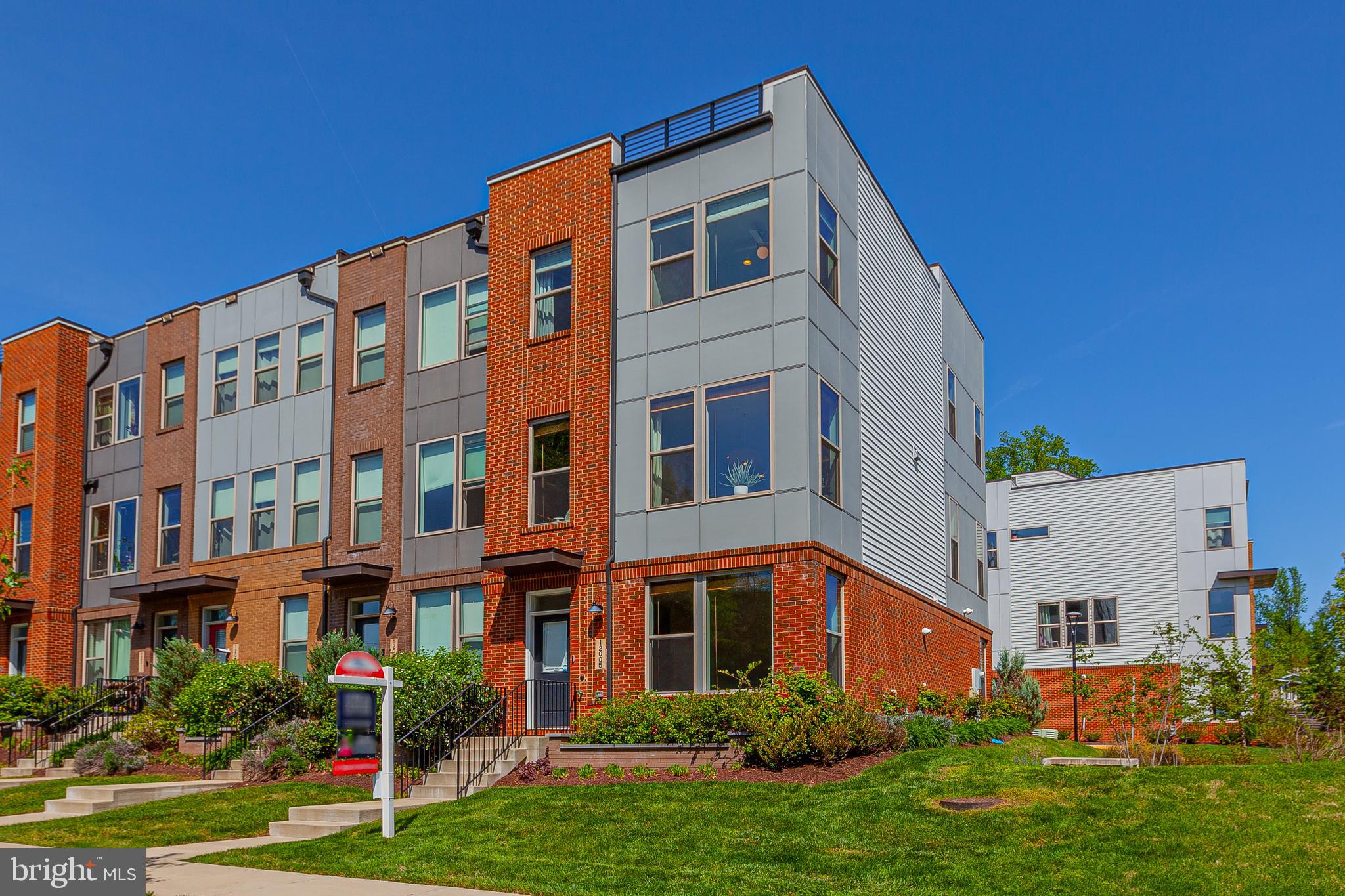 Open House Sunday May 4th (1-3pm) -WOW! This stunning, end unit luxury townhome in sought after Randolph Farms has it all! Located at the far end of the community on a quiet circle, the placement within the community is ideal. Filled with contemporary flair and modern features, this four level property features a welcoming main level family room with large storage closet, a half bathroom, and access to a sizable, two car garage! An open concept upper level is flooded with natural light and holds a relaxing living room with sliding door to deck, a sensational, gourmet kitchen with island, a spacious dining area, private office nook, and an additional half bathroom! The upper level includes two large guest rooms, a hall bathroom, and an enormous primary suite with walk in closet and an impressive en-suite bathroom! A private rooftop balcony offers amazing views and the perfect spot for at home gardening or entertainment! This can't beat location offers close proximity to Red Line Metro, area schools, local shopping, and major commuter routes! Come quickly!