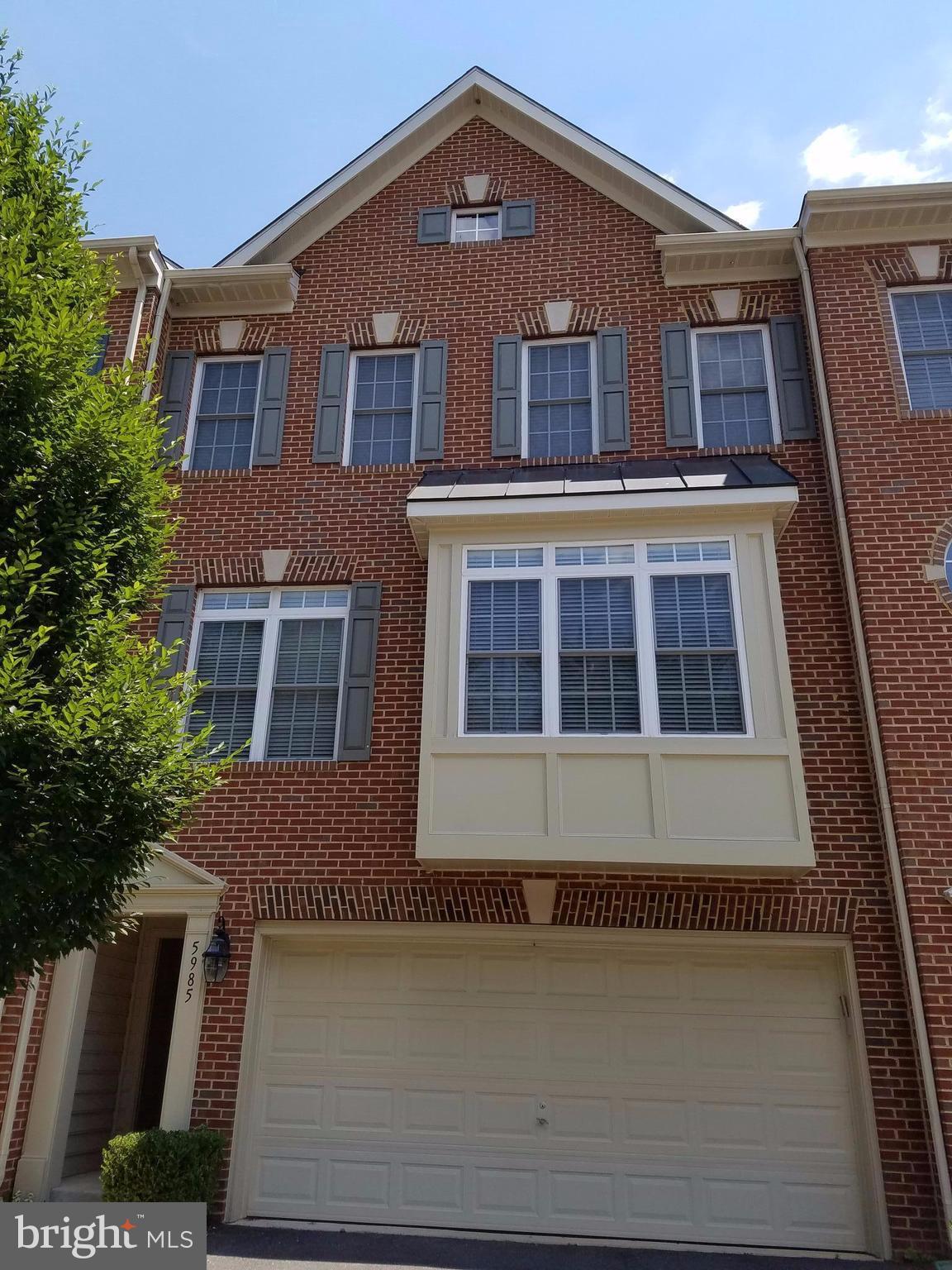 Large luxury 2 car garage townhome near VRE commuter station(1/4 mile) and shopping centers(1 2 miles) with H-mart and Whole Food Grocery! Kitchen with newer stainless steel appliances with gas stove. The main level has hardwood floors, 10 ft. ceilings/very airy and a gas fireplace! Deck for summer bbq.  Fenced backyard.  Tenant occupied.  Available June 1 or earlier