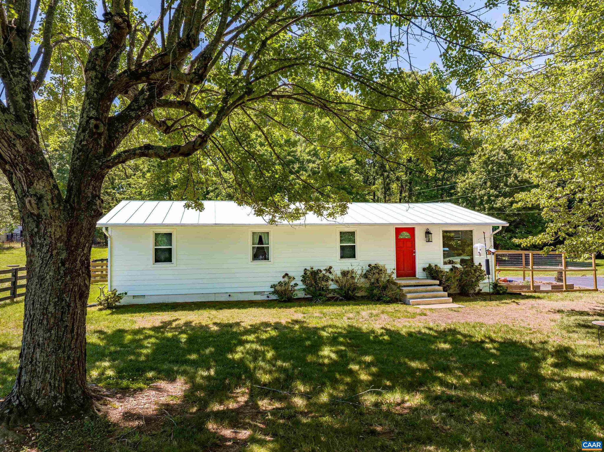 Back on the market through no fault of the Seller!  Set on 2.575 acres and just minutes from everyday conveniences, this thoughtfully remodeled one-level home offers the ideal combination of privacy, charm, and accessibility. Conveniently located only 10 min. from Hollymead Town Center and Ruckersville, and just 5 min. to NGIC, you can enjoy peaceful country living without sacrificing proximity to shopping, dining, and commuting routes. Inside, the home features 3 BR and 2 BA across approximately 1,200sf, with stylish updates completed in 2018 including a renovated kitchen and updated bathrooms. Outside, the flat and usable yard offers endless opportunities for gardening, recreation, or simply enjoying the surrounding landscape. Unwind on the spacious back porch overlooking the property, or make use of the fenced paddock area ideal for animals, hobbies, or additional outdoor flexibility. Recent major improvements include a newly painted metal roof, new septic system installed in 2021, and durable fiber cement siding added in 2024, providing both peace of mind and low-maintenance living for years to come. A rare opportunity to enjoy updated living, usable acreage, and a convenient location all in one package.,Solid Surface Counter,White Cabinets
