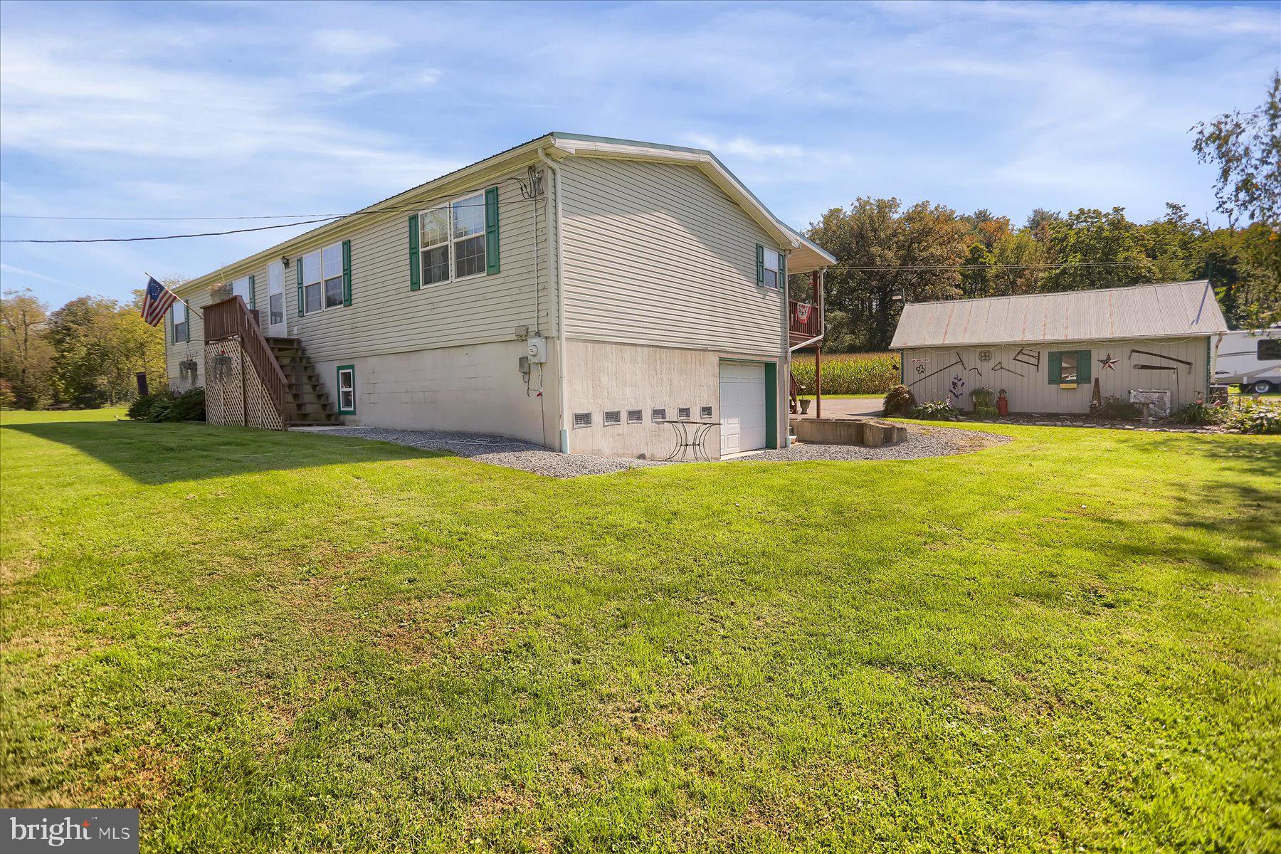 NEW PRICE!! Great opportunity for you! This charming, well-maintained home awaits. Offering 4 bedrooms, 2 full baths on 0.81 acres you can move right in and enjoy the stunning views of the surrounding landscape.
 It is the thoughtful details that make this home special with wood wainscoting in the hallway and a charmingly styled kitchen, that makes this home cozy and warm. 

Many recent updates include central air (2021), a kitchen remodel with new appliances (2022), and a tin roof (2017/2018), making this home move-in ready. Ample storage is available in the basement and two outdoor sheds with electricity, which is great for hobbies or additional storage needs.
Nestled near Bald Eagle State Park, Lock Haven University, great fishing locations, hiking areas making it a great location for outdoor adventures but still close to local amenities. Hop in your car and take a trip to Penn State about 40 minutes away. See it today and make it home!