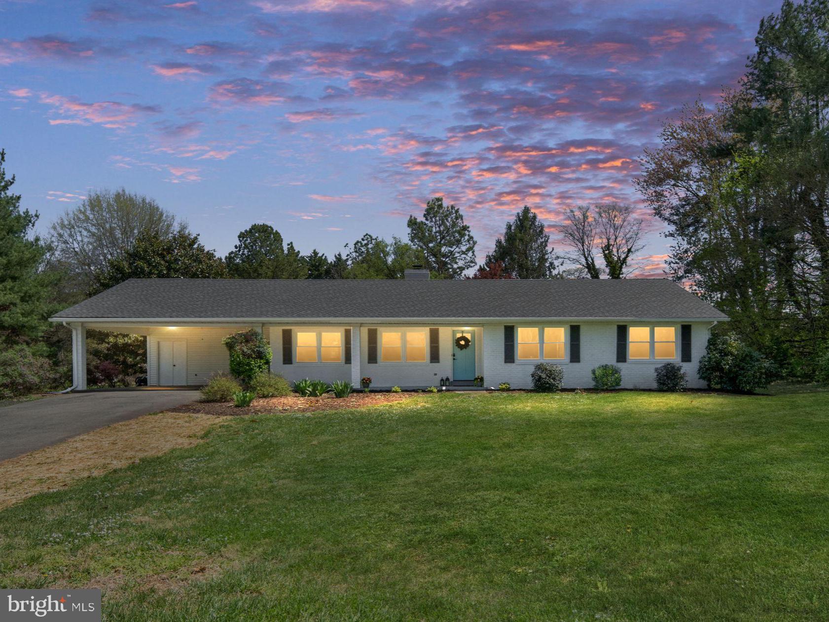 Beautifully renovated 3-bedroom, 3 full bath all-brick rambler offering 1,816 square feet of living space, situated on over 1 acre in a peaceful, no-thru-traffic setting with quick access to Rt. 29. Renovated in 2023, this home showcases a perfect blend of modern luxury and timeless charm. Inside, you’ll find premium flooring, designer lighting, and a stunning, fully remodeled kitchen featuring granite countertops, stainless steel appliances, and stylish finishes throughout. The bathrooms have been thoughtfully updated with high-end fixtures and tile work, creating a polished, move-in-ready feel. Abundant natural light fills the home, enhancing the warm and inviting spaces. A beautiful woodstove serves as a cozy focal point, adding both character and functionality. Enjoy seamless indoor-outdoor living with a covered front breezeway, rear porch, and stone patio—perfect for relaxing or entertaining. Major recent improvements provide exceptional value and peace of mind, including a new roof (2023), new HVAC system (2023), new hot water heater, all new energy-efficient windows (2024), a crawlspace drainage system with sump pump, and structural support enhancements. Additional updates include fresh paint touch-ups, a freshly painted front porch, full exterior power washing, and refreshed landscaping. Situated on a spacious 1+ acre lot with professional landscaping, a large 2-car carport, attached storage, and attic space, this home offers both privacy and convenience. Move-in ready with key systems already addressed—just unpack and enjoy!
