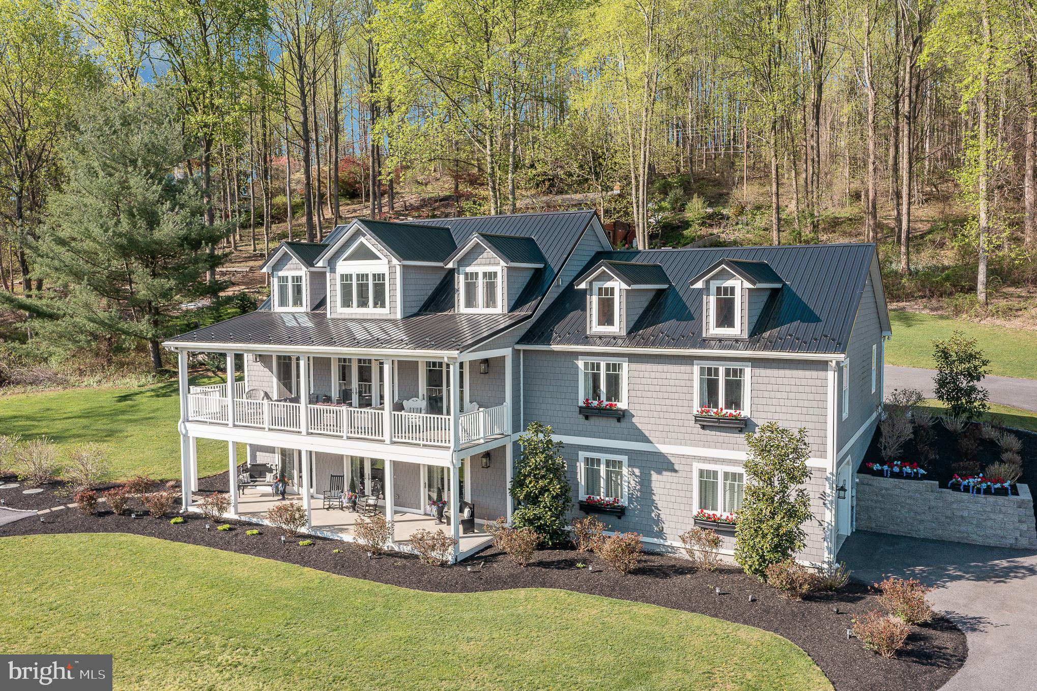 Welcome Home, To This One-of-a-kind, Lake View Home.  This custom beauty features 4 Large Bedrooms and 3 Full Baths on 1.39 acre. This is one floor living for those that are looking for a Rancher when you enter from the back. The home would also be great for large families or In- laws with their own wing on the Main Level.  Custom designed so that every major room including the basement has stunning lake & mountain views. The main level features an open floor plan with 9 Ft ceilings, crown molding, French doors, 8 Ft sliders & vinyl plank flooring. The kitchen boasts 42 in cabinets, stunning quartz counter tops, a large island and SS appliances. Also, on the Main level are 2 of the Bedrooms, 3 Walk in closets and 2 full baths.  The upper level was just completed in 2022 and features 2 large bedrooms, multi-purpose room, & full bath. The large unfinished basement has endless possibilities- rough in for full bath & ample space for multiple rooms/in law suite/etc. This home's foundation was constructed with Superior Walls and is very energy efficient with low utility bills.  There is a 2 Car oversized garage with attic storage on main level, plus a one car garage on lowest level.  French doors open to a 10 ft wide covered porch with Trex decking, ceiling fans and vinyl railings.  Enjoy the outside space all year around while taking in the views and canoes on the lake. Dual heating and AC zones. Generac Generator. Beautifully landscaped gardens with lighting.   Packed with extras & unique touches throughout.  Located minutes from the MD Line & Liberty Mountain Resort. Only 30 Minutes from Frederick Md!  Pa is a tax savings state for the retired at this time. Seller is a Md -Pa Real Estate Broker.