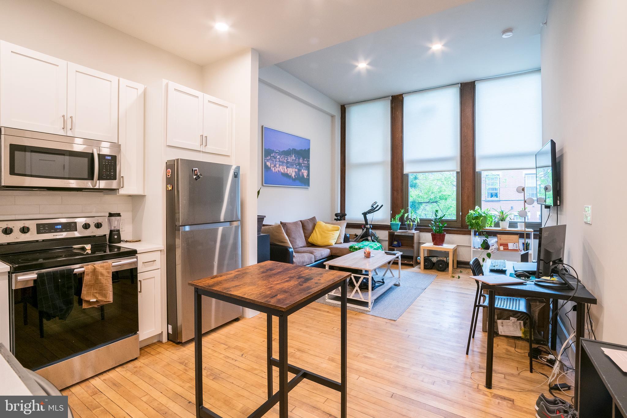 *Available 6/1*

This unit has soaring high ceilings with three oversized windows that illuminates the open floor plan living room. The bright white kitchen features texted white subway tiles with white quartz counter tops and a complete stainless steel appliance package. Right off the kitchen is the the full bathroom with a modern tiled shower/tub and vanity that matches the kitchen. There is a deep laundry closet near the entry of the unit, plus a storage closet within the living area. Tucked away is the the bedroom, which includes a large closet and another large window providing great natural light. You control the cooling and heating with the unit's mini-split system.

The Walter George Smith Public School, listed on the National Register of Historic Places, has undergone an amazing transformation to bring you these luxury apartments! Each unit features high end finishes while preserving it’s historic character such as the chalkboards, original trim and closets, and overall unique floor plan. All tenants will have access to the two outdoor spaces (over half an acre combined!) on ground floor and mezzanine patios, and roof deck with stellar skyline views! Located at 19th and Wharton in Point Breeze, you’ll be minutes from the OCF Coffee House, American Sardine Bar, Graduate Hospital, East Passyunk and MORE!

Lease Terms: Generally, 1st month, and 1 month security deposit due at, or prior to, lease signing. Other terms may be required by Landlord such as last month's rent upfront. $65 application fee per applicant. Tenants are responsible for: electricity, gas (if applicable), cable/internet and $10/mo technology fee. Water is a flat monthly fee of $60. Additional fees or requirements may be applicable for units with Homeowners or Condo Associations. Landlord Requirements: Applicants to make 3x the monthly rent in verifiable gross income, credit history to be considered, no evictions within the past 5 years, and must have a verifiable rental history with on-time rental payments. Exceptions to this criteria may exist under the law and will be considered. Cosigners will be considered.

*Price reflects the net effective rent when a 2-week credit is applied at $1,500/mo.
*Sorry, no cats, 1 dog under 45 lbs OK; $50/mo pet fee required
*Photos of a similar unit. Finishes may vary.