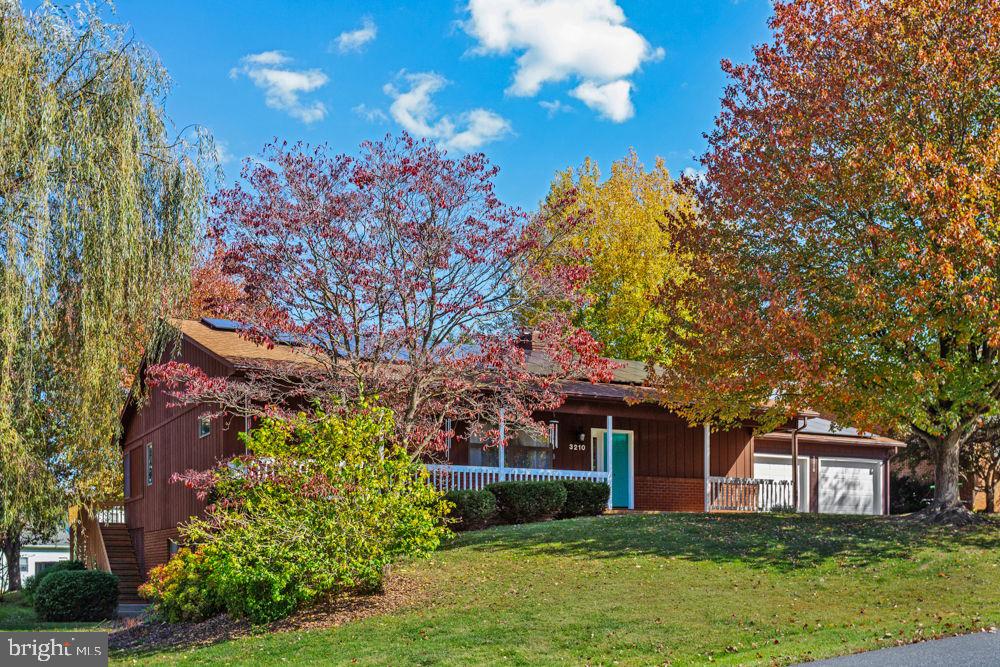 MOVE-IN READY! Spacious and energy-efficient home located in the established Lakewood neighborhood, convenient to the golf course, hospital, medical offices, and all of Harrisonburg’s amenities. Enjoy relaxing on the 488 sq ft partially covered rear deck overlooking a mature backyard. Hardwood floors welcome you into the open living and dining areas featuring vaulted ceilings, built-ins, a cozy gas fireplace, and access to the sunroom. The spacious galley kitchen offers a gas range, abundant cabinet and prep space, and access to the sunroom. The main level includes the owner’s suite with full bath, two additional bedrooms, full hall bath, and laundry. New lighting features allow comfort control from cool to warm tones. The finished terrace level offers excellent rental or multi-generational living potential with an open living/dining area, full kitchen, full bath, laundry room, and unfinished storage space. Previously used as an Airbnb rental generating approximately $120–$150 per night (not currently active). A versatile home in a prime location!