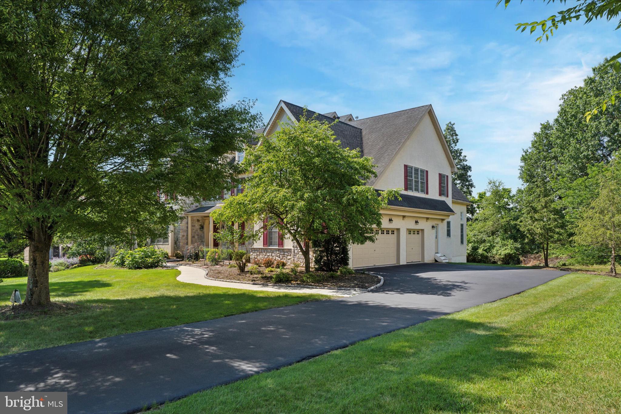 Nestled in a private cul-de-sac in the highly coveted Village at Trewellyn enclave in Lower Gwynedd, PA, this stately Colonial residence offers the perfect blend of serenity and convenience. With over 7,000 sq. ft. of living space on a beautifully landscaped 0.52-acre lot, this home offers abundant natural light and enjoys stunning southern exposure.
This 5-bedroom, 4 full and 2 half-bath estate combines proximity to preserved land and nature with easy access to shops, dining, and major roadways.
On the first floor, the welcoming Living Room showcases expansive windows offering a panoramic view of lush, tree-lined scenery.  Also with elegant Formal Dining Room, quiet, efficient Home Office, Mudroom, laundry area, and two Powder Rooms.  Expansive Gourmet Kitchen with updated appliances, walk-in Pantry, and adjoining sunlit Breakfast Room, seamlessly flowing to a maintenance-free deck, ideal for entertaining.  Dramatic two-story Family Room with a cozy fireplace maximizes southern exposure, perfect for enjoying the winter sunshine with families!

The secondary staircase next to the Family Room leads to the Second Floor, with four spacious bedrooms and three full baths.  This includes luxurious Owner’s Suite featuring a Sitting area, generous walk-in closets, and a spa-like Master Bath.

In the Walkout Basement, the finished area has a bedroom, full bath, wet bar, and versatile space for living and recreation.  Unfinished section offers ample storage, mechanical rooms. Direct access to the backyard, which is adjacent to the scenic meadow of Gwynedd Mercy University.
This estate has elegant stone/stucco exterior with attached 3-car garage, Central gas heating & A/C with Ecobee smart thermostats for year-round comfort, new water heaters, and efficient gas cooking.
This property is located in Lower Gwynedd Township within the Blue Ribbon Wissahickon School District.  Minutes from Whole Foods, Trader Joe’s, Costco, and multiple grocery and restaurant options in Montgomeryville. Easy access to Route 309 and the PA Turnpike, connecting seamlessly to New Jersey and western Pennsylvania.  Set deep in the Village at Trewellyn and connected to the Lower Gwynedd trail system, this property is a haven for nature lovers. Enjoy seasonal beauty, wildlife sightings, and stargazing—all from the comfort of your backyard.
This rare Lower Gwynedd gem truly has it all—space, elegance, convenience, and a front-row seat to nature.
