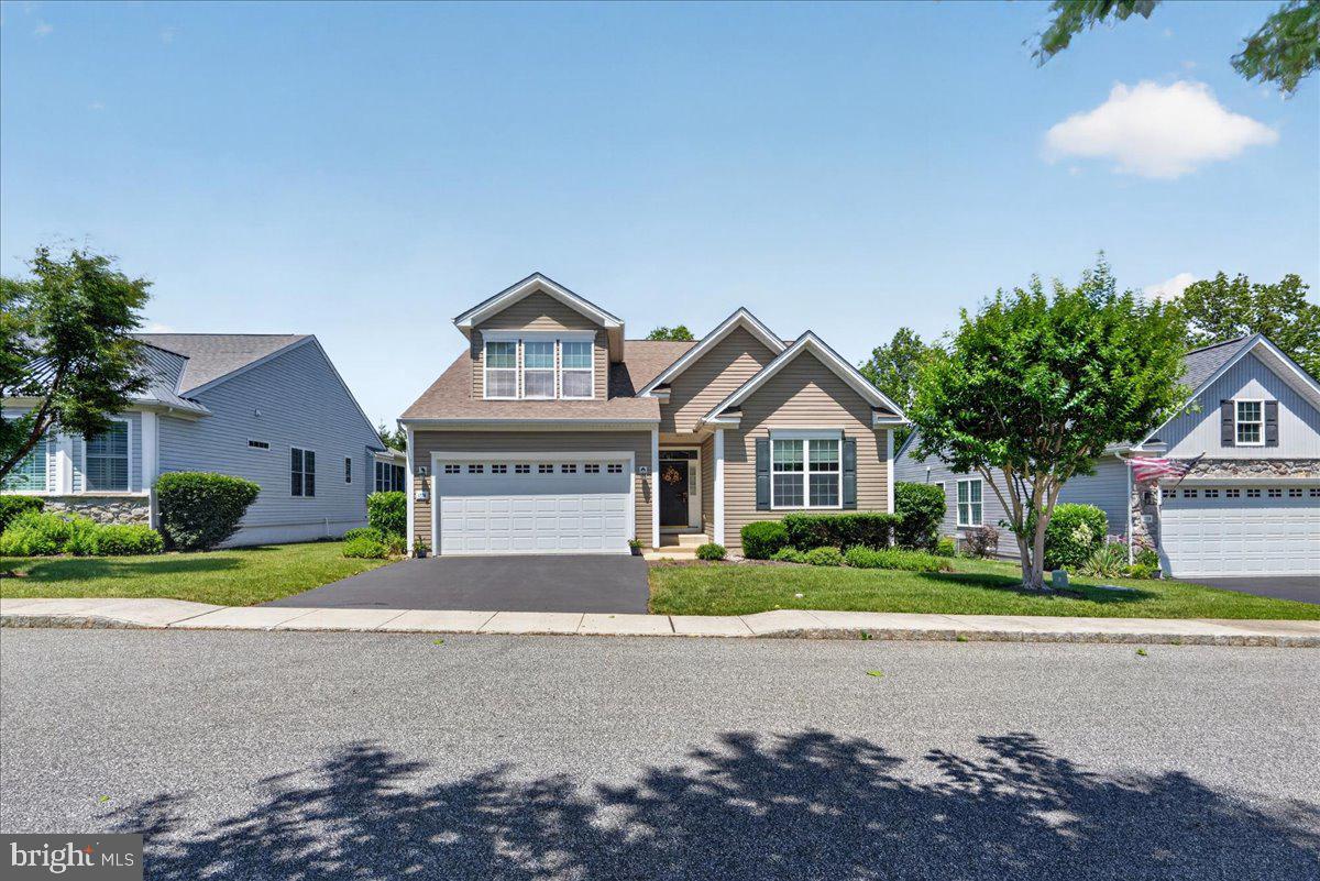 Experience effortless living in this beautifully appointed ranch home, nestled within a sought-after 55+ community. Built in 2010 and offering 1,703 square feet of thoughtfully designed living space, this residence combines elegant finishes with exceptional comfort.

The heart of the home is the stunning kitchen, featuring granite countertops, a tile backsplash, abundant cabinetry, a center island, and a sunny breakfast area. A formal dining room with rich wood flooring provides the perfect setting for entertaining, while the spacious living room offers a welcoming atmosphere for everyday relaxation. Plantation shutters on windows add timeless style and charm.

The expansive primary suite is a true retreat, complete with a tray ceiling, ceiling fan, dual walk-in closets, and a spacious private bath. Two additional bedrooms and two full bathrooms provide ample accommodations for family and guests.

A convenient main-level laundry room includes a utility sink, washer and dryer, and direct access to the attached two-car garage.

The unfinished lower level presents an incredible opportunity, offering more than 1,700 square feet of additional living space already framed and ready for completion. Whether you envision a recreation room, home theater, fitness area, guest suite, or all of the above, the possibilities are endless.

Step outside to enjoy peaceful mornings and relaxing evenings on the screened patio. Residents enjoy access to resort-style amenities, including a swimming pool, recreation center, and sports courts, while the association handles lawn care and common area maintenance.

Move-in ready and filled with potential, this exceptional home offers the perfect blend of luxury, convenience, and carefree living.
