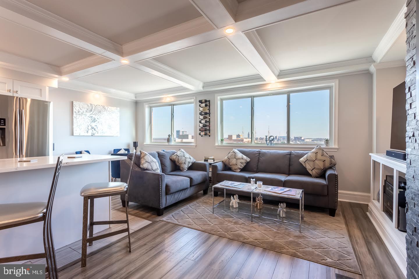 Move right into this beautifully renovated top-floor bi-level condo in Head House Square, offering breathtaking panoramic views of the city and river from your private balcony.

The main level features an open floor plan with a spacious living area, a custom stone fireplace, a modern powder room, and a stylish dining area. The ultra-modern kitchen is equipped with Calcutta Quartz countertops, a subway tile backsplash, a breakfast bar, sleek white cabinetry, a large pantry, and stainless steel appliances.

Upstairs, the luxurious bedroom suite includes two large walk-in closets (4’x10’ and 5’x7’), a cozy seating area, and direct balcony access—perfect for morning coffee or evening relaxation. The oversized bathroom features a double marble vanity, a custom walk-in shower, and an in-unit laundry area.

Additional features include Pella hurricane/soundproof windows and balcony door, newer ductless A/C units on each level, custom coffered ceilings, and laminate & bamboo flooring.

Residents of Abbotts Square Condo enjoy access to a renovated gym and a peaceful outdoor seating area—ideal for reading or walking your pet.

Live in the heart of Head House Square, just steps from restaurants, bars, Spruce Street Harbor, and everything the city has to offer.

Don't miss out—schedule a tour today and make this incredible condo your next home!