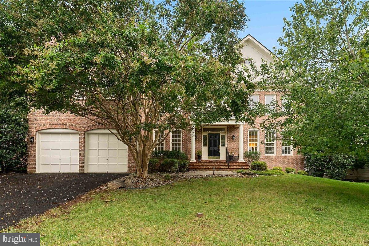 Discover an exquisite blend of elegance and comfort in this stunning Colonial residence, nestled within a prestigious gated community. Spanning over 4,156 square feet, this home boasts five spacious bedrooms and four and a half luxurious bathrooms, designed for both relaxation and entertaining. Step inside to find a grand foyer adorned with crown moldings and rich wood floors, leading to an open floor plan that seamlessly connects the gourmet kitchen and light filled two story family room. The kitchen is a culinary masterpiece, featuring upgraded countertops, a large island, and top-of-the-line stainless steel appliances, including a double oven and gas cooktop, lots of recessed lights and under cabinet lights. A butler's pantry enhances functionality, while the breakfast area invites casual dining. Retreat to the opulent primary suite, complete with a walk-in closet and a spa-like bathroom featuring a soaking tub and stall shower with dual shower heads. This home includes built in speakers, for whole house audio, located in the family room, lower level recreation room, primary bedroom and bathroom.  The fully finished basement offers additional living space, a legal bedroom and full bathroom, additional washer and dryer connections, a theater room that is already wired with surround sound and speakers (the only things you need are the projector and screen), complete with a walkout entrance, perfect for hosting gatherings or enjoying quiet evenings by the fireplace. Outside, the property is beautifully landscaped, with night lighting, backing to serene wooded views that provide a tranquil backdrop. Enjoy outdoor living on the expansive Trex deck or patio, ideal for entertaining or unwinding in nature. Both the UL deck and the LL patio have gas connections for the grill!  The 2 car garage is oversized and include a professional grade safe, while still allowing room for the cars.  The community amenities include a sparkling pool, tennis courts, and a fitness center, ensuring a lifestyle of leisure and luxury. With an attached garage and ample parking, this home is a true sanctuary, offering an unparalleled living experience in a coveted location. Embrace the exclusive lifestyle that awaits you in this remarkable property.  Recent updates:  ROOF 2021; H20 HEATER 2024; UL HVAC 2021; LL HVAC COMPRESSOR 2024