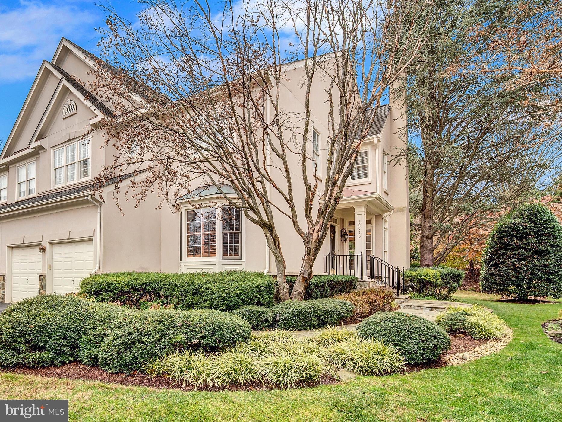 **Gorgeous VILLA semi-attached**

Located in the highly desirable Bells Mill Estates community of Potomac, this exceptional Stanley Martin–built home offers an outstanding floor plan with over 5,000 SF of living space across three levels. The residence has beautiful curb appeal with a stucco exterior, mature manicured landscaping with lighting, an underground sprinkler system in both front and back yards, and a flagstone pathway leading to the front door.

Main Level:
The main level features hardwood flooring throughout and a grand foyer with tall ceilings that set the tone for the home’s elegant interior. The sunlit living room offers a marble-faced fireplace, and the formal dining room includes custom wall moldings. The spacious great room is a showstopper, with soaring 18’ ceilings, oversized windows, custom built-ins, and a second gas fireplace.
The island kitchen provides ample storage, stainless steel appliances, granite countertops, and an adjacent breakfast room large enough to seat six. A private den/library with a large bay window and floor-to-ceiling built-ins completes the main level.

Upper Level:
Upstairs, the primary suite includes a tray ceiling, a custom built-in window seat with storage, two walk-in closets (one with built-ins), and a large primary bath featuring double sinks, a shower, and a separate jacuzzi tub. A large en-suite guest bedroom and two additional spacious bedrooms complete the level—one with closet built-ins and another with a built-in desk ideal for a study or home office. Two full bathrooms serve the secondary bedrooms.

Lower Level:
The lower level offers tall ceilings, a large recreation room, a home gym/exercise room, an additional bedroom/office, a walk-in cedar wardrobe closet, a small wine storage area, and a laundry room. There is also a dedicated space for a fourth bathroom, with plumbing roughed in and ready to be finished. The lower level provides walkout access to the backyard.

Outdoor Living:
Directly off the great room is a private and fabulous backyard, perfect for entertaining or relaxing. The expansive two-tiered double wood deck offers generous space for grilling, outdoor dining, and lounging, while the property backs to a beautiful park with a new playground.

Additional highlights include two-zoned heating and cooling and washer/dryer hookup available in the primary bedroom closet. The home is less than a block to Bells Mill ES, across the park to Cabin John MS, a short distance to Churchill HS, and minutes to the Cabin John Shopping Center’s dining, retail, and conveniences.