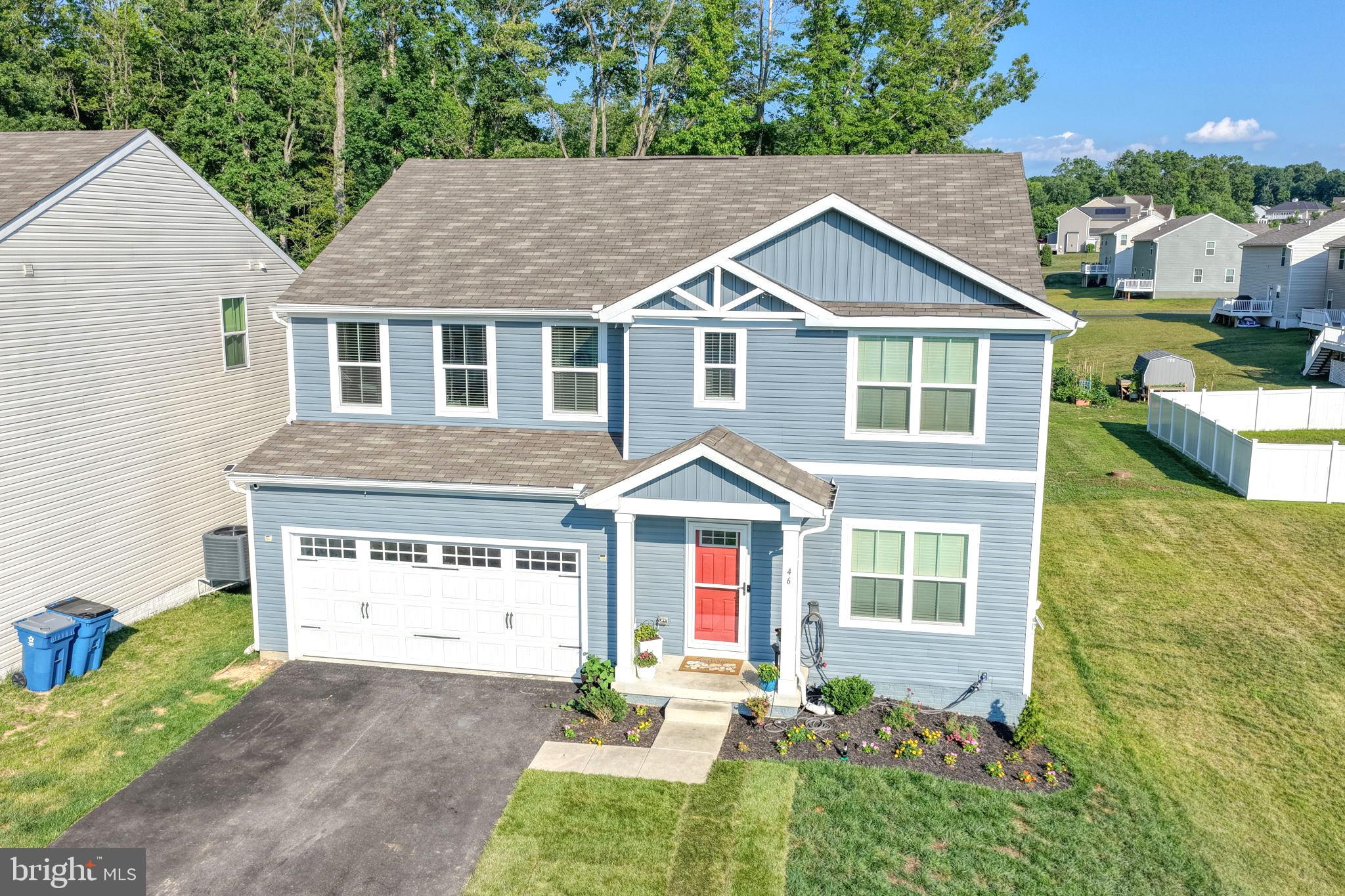 Welcome to 46 Goldspire Drive!

Why wait for new construction when you can own this beautifully upgraded 5-bedroom, 3-bath home in the desirable Ridgely Forest community? Offering over 2,560 square feet of finished living space, plus an approximately 1,000-square-foot unfinished basement, this home provides plenty of room to enjoy today while offering endless possibilities for future expansion.

Situated on a flag lot with a long private driveway, this property offers a unique setting with added space between neighboring homes and an oversized driveway for additional parking.

Step inside to discover a bright, open-concept floor plan designed for both everyday living and entertaining. The spacious layout flows seamlessly from the living area into the kitchen, creating an inviting space that's ideal for everyday living and hosting gatherings.

The kitchen is the heart of the home, featuring quartz countertops, abundant cabinetry, an oversized center island, a spacious pantry, and added lighting above the sink. Thoughtful upgrades include electrical outlets inside the pantry, making it easy to store and use small appliances while keeping countertops organized.

A main-level bedroom and full bathroom provide excellent flexibility for overnight guests, extended stays, or a private home office.

Upstairs, you'll find a spacious loft that can easily serve as a second living area, media room, playroom, home office, or flex space to fit your lifestyle.

Storage is abundant throughout the home with walk-in closets in every bedroom, two walk-in closets in the primary suite, multiple linen closets, a front coat closet, and a mudroom closet with a dedicated outlet for charging a cordless vacuum.

The unfinished basement, approximately 1,000 square feet, offers an excellent opportunity to customize the space with a recreation room, home gym, theater, additional bedrooms, or a future full bathroom, subject to buyer verification and local approvals.

Additional Features Include:

Oversized driveway with parking for up to 4 vehicles
Attached 2-car garage
EV charger installed in the garage
Upper-level laundry room
Flexible front room ideal for a home office, formal living room, playroom, or study
Modern finishes throughout and the benefits of nearly new construction. 

 Amenities within the community includes a pool, clubhouse, playground, dog park, walking trails, and open green spaces. In addition convenient access to shopping, dining, marinas, and major commuter routes to Delaware, Baltimore, and Philadelphia.

Schedule your private showing today!