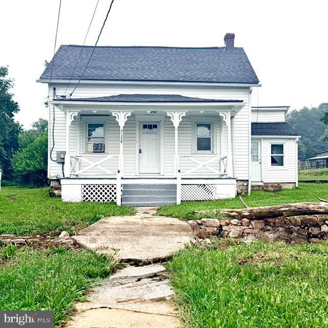 Charming, peaceful, and full of country character—this adorable home is a must-see! Whether you're searching for your first home, looking to downsize, or simply wanting a place to enjoy a quieter pace of life, this property offers the perfect blend of comfort and charm.

Situated on a large, level lot backing to a small farm, you'll love watching the neighboring farm animals while enjoying the peaceful surroundings. A beautiful creek meanders through the front of the property, complete with charming wooden bridges that create a truly storybook setting.

Inside, you'll find fresh paint throughout, easy-care laminate flooring, a cozy living room, dining area, and a spacious kitchen with an adjoining laundry room and access to the covered rear porch—perfect for relaxing or entertaining. The welcoming front porch is the ideal place to unwind with your morning coffee while listening to the soothing sounds of the flowing creek and taking in the scenic countryside.

Upstairs offers two comfortable bedrooms along with a generously sized walk-in closet. Additional features include a cellar for extra storage and a storage shed for lawn and garden equipment.

If you've been dreaming of peaceful country living with plenty of charm, this inviting home is ready to welcome you home.