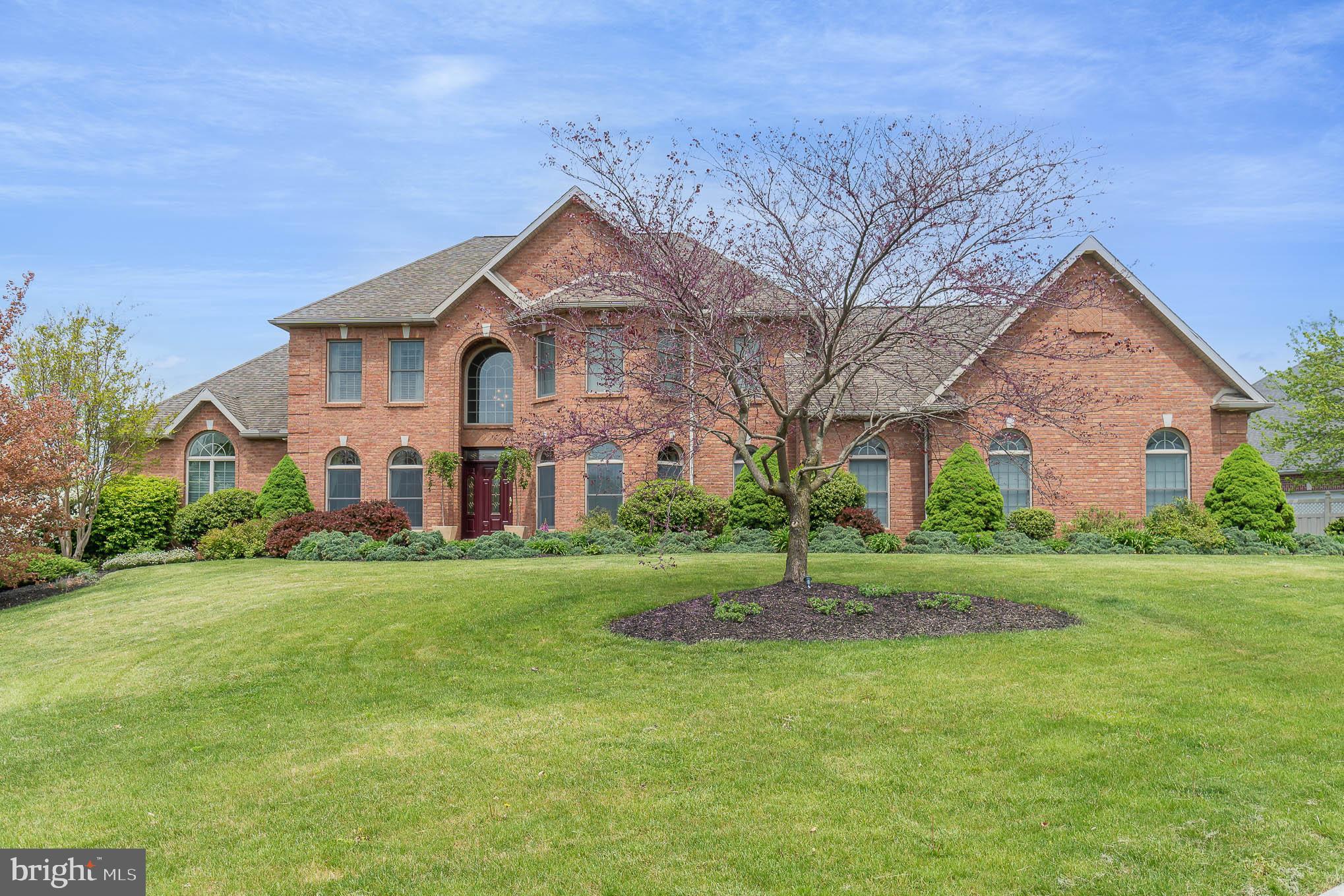 Come tour this fabulous Mumper custom-built home in the Estate Community of Lindenwood.  Step through the front door to a grand 2 story foyer.  The architectural detail surrounds you.  Tasteful arches, columns, wainscoting - and nooks to showcase your art!  To the right is the formal dining room, stylish & elegant.  Recessed lighting in the tray ceiling sets the mood for relaxed entertaining.  Tucked to the left through French doors is the library - a little gem, rich in detail.  Straight ahead is the great room with a breathtaking floor-to-ceiling stone fireplace with two intricately crafted mantels.  The flow of the floorplan design makes this space great for large gatherings and perfect for intimate groups. This fantastic kitchen offers choices!  You can cozy up to the island/breakfast bar, sit at the table, or pop out to the awesome covered deck with room enough to grill, dine and party!  Or enjoy quiet time on the deck, listening to the soothing sounds of the waterfall while you read, nap, or chat with a friend.  The chef's kitchen features granite counter tops, stainless steel appliances, and Tom Clark custom cabinets, as well as a generous walk-in pantry.  Brazilian cherry hardwood floors lead the way to the first floor owners retreat.  This beautiful suite features a double-sided fireplace next to a cozy sitting room with a wet bar.  Just off the sitting room is a private office with custom built-ins.  The primary bath speaks luxury.  Soak in the jetted tub, or pamper yourself in the oversized tiled shower with multiple shower jets.  Upstairs you'll find a second primary bedroom, plus two additional bedrooms connected by a Jack & Jill bathroom.  There's a full footprint walkout lower level that is unfinished - except for the hidden room outfitted with a stunning contemporary fireplace.  A little getaway!  This exceptional home sits on a corner lot in a lovely neighborhood - just a short walk to both the Upper Allen Elementary School and the Mechanicsburg Middle School.  Minutes to Rt 15 and PA Turnpike... and just another couple minutes to Trader Joes!
