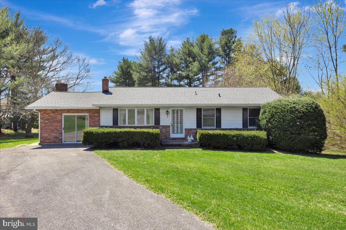 Welcome to this three-bedroom, two-bath rancher located at the end of a quiet cul-de-sac in the desirable "Rolling Hills" community of Sykesville. Situated on an over half-acre lot, this well-maintained home offers several important improvements and provides a great opportunity for buyers to make it their own with enhancements and personal touches added over time. The main level features an inviting kitchen with room to personalize, a formal dining room, a living room, and a separate family room with a wood-burning fireplace located right off the kitchen. The family room also provides access to a rear covered deck that overlooks the backyard, which is a good size and fairly level—perfect for outdoor activities or gardening. You'll also find three comfortably sized bedrooms and a full bath on the main level. The spacious walk-out basement is an open canvas, offering plenty of potential to finish exactly the way you want it, and would be convenient for making improvements. The basement includes a brand-new sliding door to the rear yard and a full bath. Notable improvements include lifetime architectural shingles installed in 2014, a new "Carrier" central air and oil burning furnace system installed in 2024 (with a possible transferable warranty), new ductwork for the basement AC, and a water heater replaced in 2022. The kitchen offers an updated refrigerator with an icemaker and a stove, and a new septic line and riser were installed in 2023. Most of the original copper pipes have also been replaced with PVC. Enjoy top-rated local schools and take advantage of the home's proximity to Piney Run Park, shopping and dining in Eldersburg, as well as the charm and events of Historic Sykesville. It's also an easy commute to Frederick County, Howard County, and Baltimore. Move right in and make your updates gradually to truly transform this home into your own special place.  Some furniture has been virtually staged in the photos; no other alterations have been made.