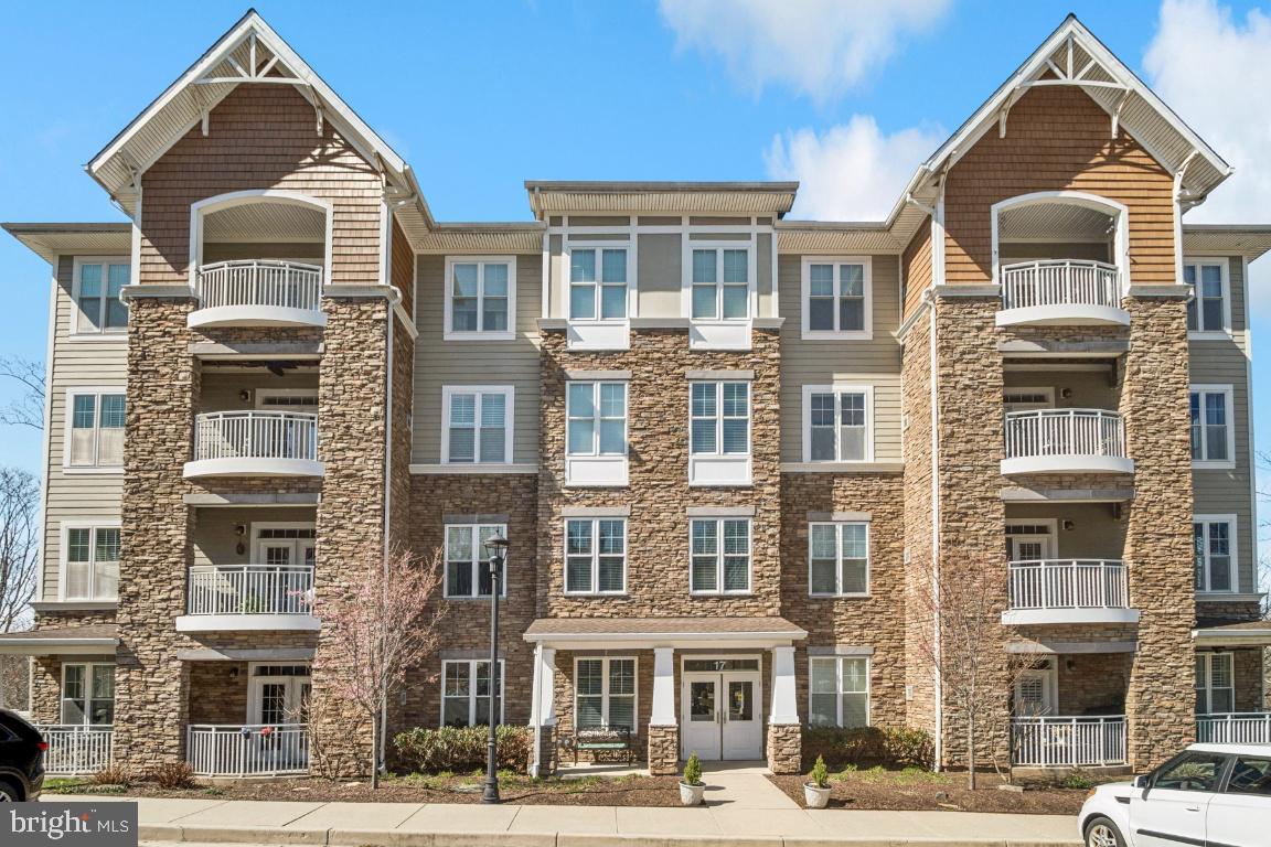 Welcome to this desirable 55+ corner-unit condominium with serene parkland views in Patapsco Overlook, Catonsville. This well-designed home offers 2 bedrooms, 2 full baths, plus a versatile den, perfect for a home office or guest space, along with the convenience of first-floor access. Enjoy an open-concept layout where the expansive kitchen features generous cabinet and counter space, now enhanced with quartz countertops, and seamlessly flows into the living and dining areas—ideal for both everyday living and entertaining. The home also features new luxury vinyl flooring (LVF) throughout, new blinds, and updated essentials including a water heater, washer, and dryer. The spacious primary suite includes a large walk-in closet, additional closet space, and a private en-suite bath with double vanity and walk-in shower. A second bedroom and full bath provide flexibility for guests or family. Additional highlights include a reserved under-building garage parking space and secure storage, offering convenience and protection from the elements. Residents enjoy access to a community center with fitness room, meeting space, and social areas, perfect for gathering with neighbors. The condo fee covers water, sewer, master insurance, exterior maintenance, high-speed internet, and cable TV, allowing for truly low-maintenance living. Leave the yard work behind and enjoy easy, carefree living in this welcoming community!