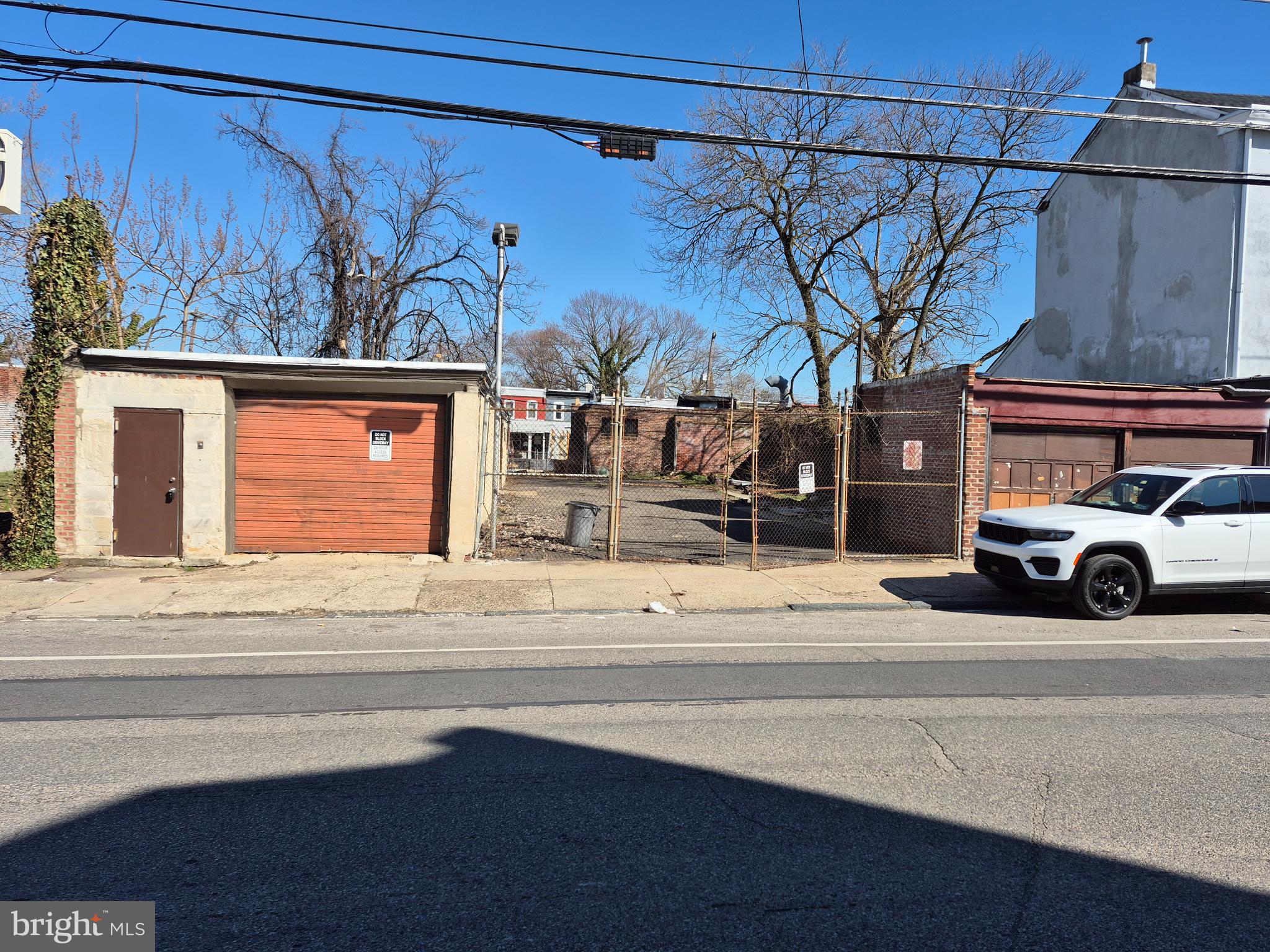 RARE PACKAGE DEAL – Two Adjacent Parcels with Commercial Potential! Exceptional opportunity to own a combined total of an 8,400 sq ft property complete with a 2,000 sq ft clear-span, 1-story building featuring front and side overhead garage doors. Perfect for equipment storage, vehicle maintenance, or contractor workspace—with enough room to park 2 or 3 semi-trucks while maintaining full use of the building. PROPERTY BREAKDOWN: Main Lot & Building: Fully fenced 63' x 90' lot housing the 2,000 sq ft building (historically used for car repair/storage). At the rear of this long open building is a large Half Bathroom (sink & toilet need replacing). Adjacent is the Utility/mechanical room, accessed from outdoors at rear of the building. Utilities/mechanicals are older but operational. ADJOINING PARCEL BREAKDOWN: 6142 N Beechwood St - a fully fenced 30' x  90' lot located immediately behind the main building (Tax ID #885161060; Annual RE Tax: $314; Assessment: $22,500). These parcels are offered for the first time by 50-year owners. Both lots are completely fenced and being sold together in "as-is" condition. Easy to tour—buyers are welcome to inspect the properties anytime! Call for your appointment and see if this right-priced opportunity can fit your needs!