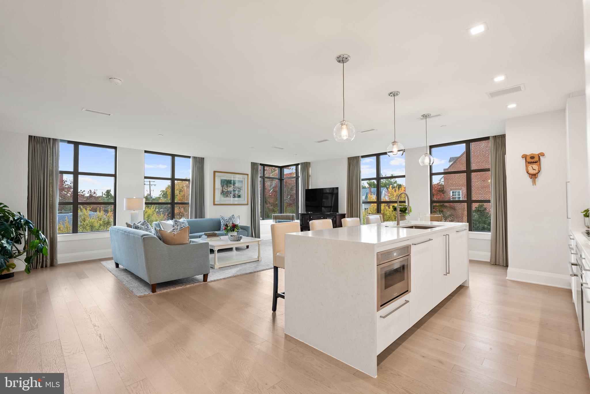 Extraordinary lifestyle at Robinson Landing. This very rare CORNER 2-bedroom 2-bath residence with 3 sides of windows, is in Old Town's premiere luxury community located on the waterfront in the heart of the historic district.  Sited amidst restaurants, coffee shops, retailers and City parks, this sun-drenched, 1,600 square foot home has luxurious finishes throughout. Enjoy custom window treatments, Snaidero kitchen cabinets, Thermador appliances, quartz countertops and 5 inch oak plank flooring in all rooms, Private balcony with gas hookup for grill, 2 garage spaces with EV charger, very large storage room, and semi-private elevator to your floor (elevated living with only 2 residences per floor). Building has great privacy and security. Robinson Landing is Old Town's most luxurious community with a platinum location and top tier amenities. The owner's lounge, library, meeting room, game room,  gym and yoga studio all have amazing water views. The same building houses the concierge desk, pet spa, kayak storage and bike storage/workshop. Dine in the waterfront restaurants, stroll along the boardwalk, shop at the Farmers Market and start enjoying life. All just minutes to Reagan National Airport, Amazon HQ2, the Capitol and all D.C. has to offer. Don't miss this amazing lifestyle opportunity!
