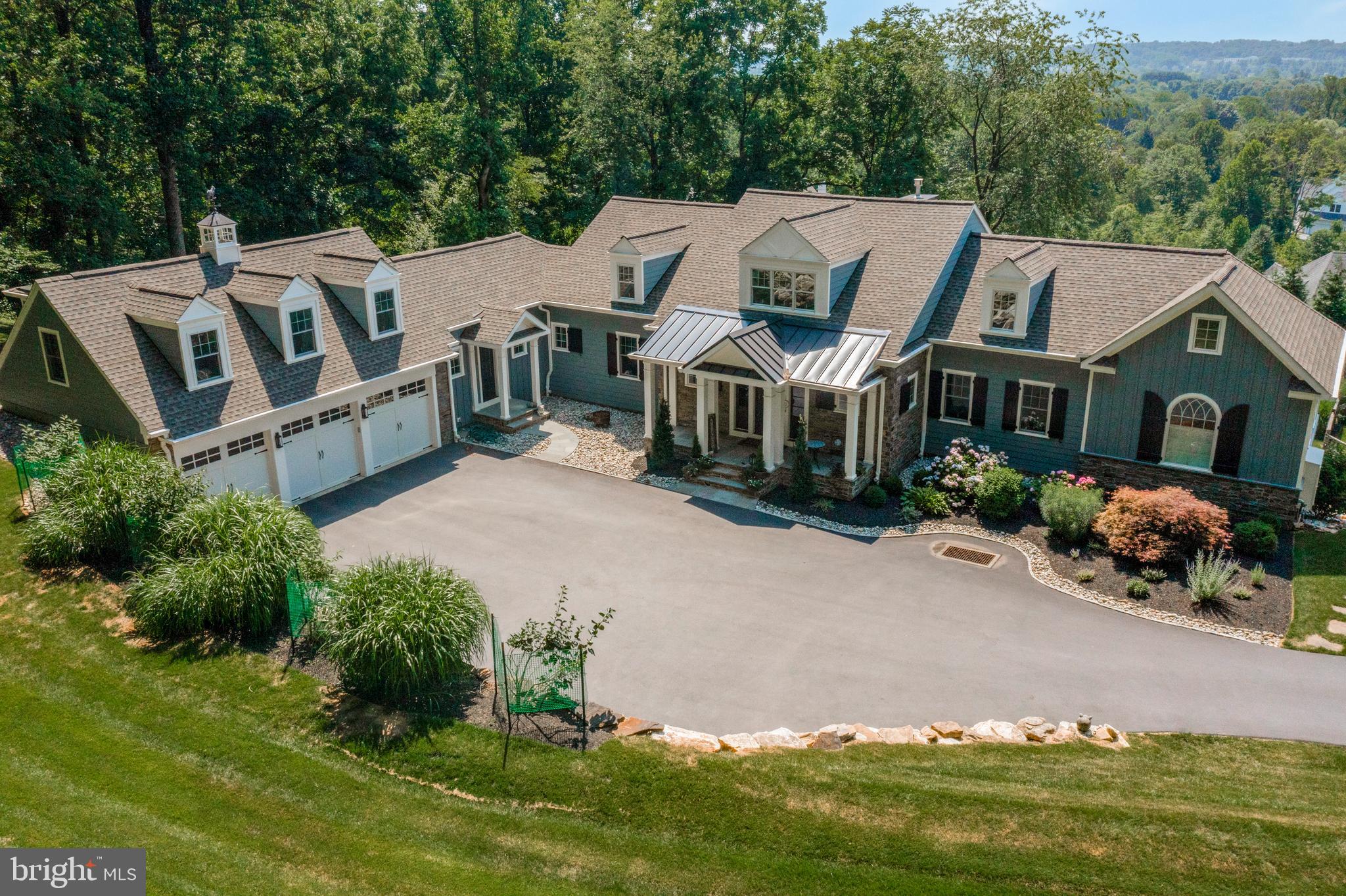Spectacular custom home in Malvern, featuring a first-floor master, 4900+ SF of finished living space and set on a scenic 2+ acre site with rolling Valley views. This impressive residence boasts 4 bedrooms, 3.5 baths, and 3 gas fireplaces, complemented by a large deck and an in-ground pool. The finished lower level showcases 10-foot ceilings. Additional highlights include 2 laundry rooms, a formal in-home office, and a versatile finished area above the garage that can be used as a 5th Bedroom, hobby room, or second office. Custom finishes abound, including a 10-foot custom kitchen island with reclaimed wood top, a 15-foot vaulted ceiling in the family room, vaulted ceilings in the master bedroom, exposed brick walls in the lower level, one of a kind "penny" floor in powder room, authentic reclaimed barn siding stairwell, Tin ceiling in butlers pantry, and multiple custom barn doors as well as a custom stained glass powder room door. Conveniently located minutes from the Malvern PA Turnpike slip, Route 202, Route 76, and Malvern Borough, this home offers easy access to amenities such as Wegmans, Target, The Grove and many restaurant and shopping options. Situated in the Great Valley School District, it is also a short drive to Malvern Prep, Episcopal Academy, Villa Maria, The Montgomery School, and other local private schools. Less than a minute away from the Chester County Trail and the Great Valley Community Center. Contact us today for more information or to schedule a tour of this remarkable property.