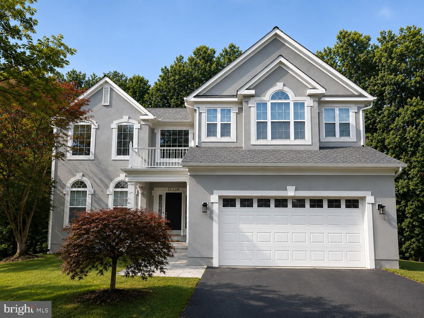 Welcome to 11216 Winding Brook Lane, where a dramatic two-story foyer, soaring ceilings, and sun-filled living spaces create an unforgettable first impression. Peacefully situated on a quiet cul-de-sac and backing to the scenic woodlands of Great Seneca Park, this meticulously maintained home offers a rare combination of timeless elegance, thoughtful design, and exceptional privacy.

From the moment you step inside, you'll appreciate the home's remarkable sense of openness. The grand two-story foyer welcomes you into a well-designed floor plan with soaring ceilings, open sight lines, and expansive windows that bathe the home in natural light. The home's exceptional layout strikes the perfect balance between openness and definition, creating bright, connected living spaces while maintaining the warmth and functionality of distinct rooms.

Rich hardwood flooring flows throughout much of the main level, continues up the elegant staircase, and extends throughout the second-floor hallway, creating a seamless sense of warmth and sophistication. Every room feels bright, inviting, and thoughtfully connected, making the home equally suited for everyday living and effortless entertaining.

The walk-out lower level offers exceptional flexibility, providing generous additional living space ideal for a recreation room, home theater, fitness area, guest suite, playroom, or home office, with direct access to the backyard.

Step outside to your own private retreat overlooking the beautiful woodlands of Great Seneca Park, where mature trees provide a peaceful backdrop and exceptional privacy throughout every season. Whether enjoying your morning coffee on the deck or hosting family and friends, you'll appreciate the tranquil setting that makes this home truly special.

Lovingly maintained by its owners, this home reflects true pride of ownership and offers valuable updates, including a roof replaced in late 2020, providing added peace of mind for years to come.

Conveniently located just minutes from I-270, MD-355, shopping centers, restaurants, grocery stores, parks, walking trails, and other everyday conveniences, this home combines the serenity of a natural setting with outstanding commuter accessibility.

With its grand two-story foyer, soaring ceilings, abundant natural light, beautifully flowing layout, extensive hardwood flooring, versatile walk-out lower level, picturesque views of Great Seneca Park, and meticulous upkeep, 11216 Winding Brook Lane presents a rare opportunity to own a truly move-in-ready home in one of Germantown's most desirable locations.