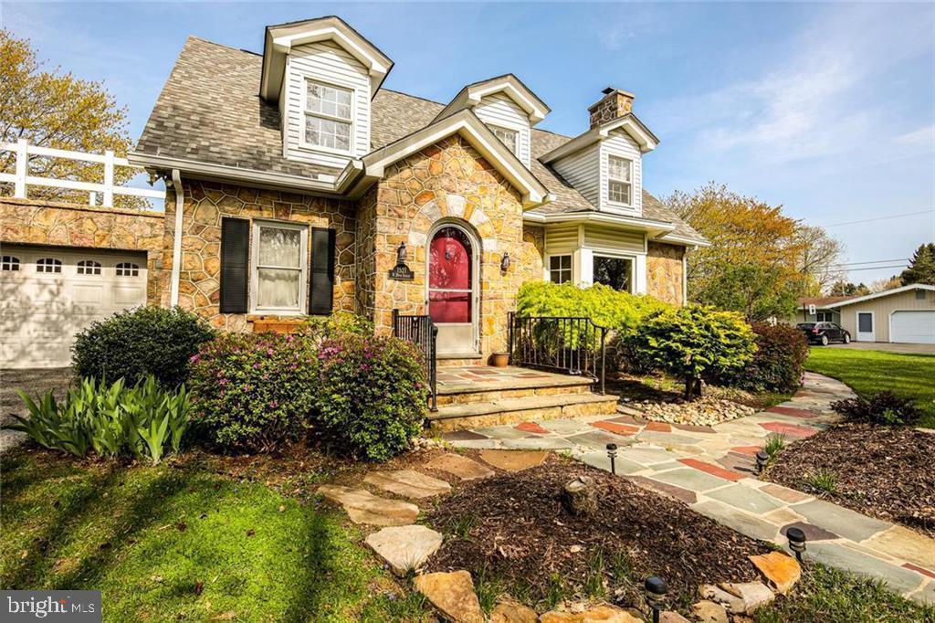 Welcome to this charming Stone Cape Cod Colonial nestled in the desirable Parkland School District. Boasting timeless charm and character, this 4-bedroom home is a perfect blend of classic elegance and modern convenience. As you approach, be greeted by an ornate arched stoneway entrance, setting the tone for the unique features within. The hardwood floors guide you through the main level, where ornate built-ins and craftsmanship catch the eye. The spacious living room is a centerpiece, featuring a stone fireplace that exudes warmth and character. Picture gatherings with loved ones or quiet evenings by the fire. Adjacent, the updated kitchen is a chef's delight with all-new appliances and a perfect blend of style and functionality. The rooftop deck provides a serene escape, offering a perfect spot for morning coffee or evening relaxation. The lower level is a hidden gem, complete with an additional wood fireplace, creating a cozy atmosphere for a family room or entertainment space. Practical updates include new central air, new windows, and a newer roof (2016). The home is equipped with a Gas HWH and a furnace installed in 2017, ensuring comfort and efficiency. Additional features include a new water softener and a radon system for peace of mind. Experience the beauty of this stone colonial, where every detail has been carefully curated to blend the past with modern living. Don't miss the opportunity to make this house your home.