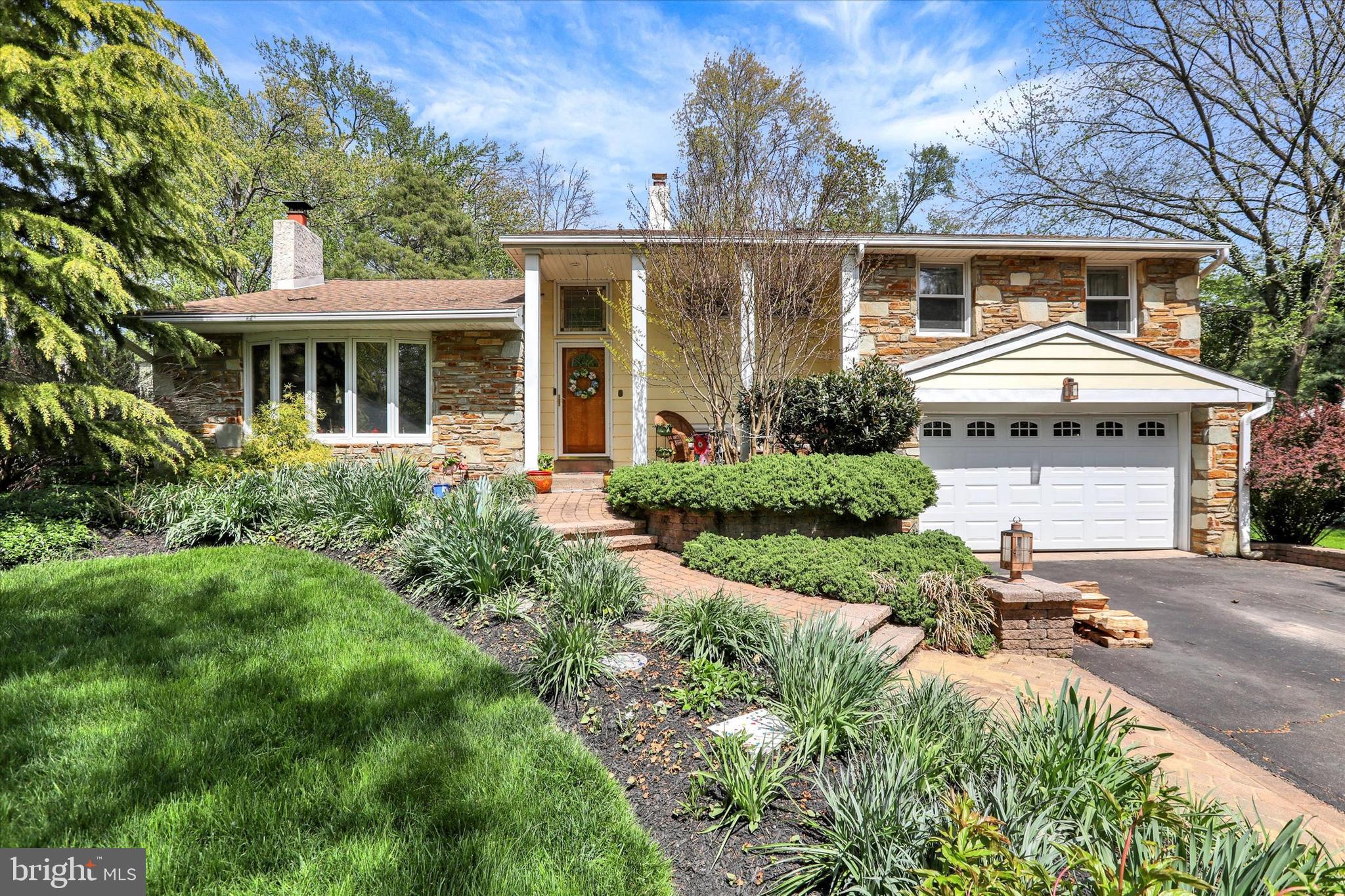Located in the desirable Churchville section of Northampton Township, this well-maintained three-bedroom, two-and-a-half-bath home offers a thoughtful layout and spaces designed for both everyday living and entertaining. A two-story foyer creates a welcoming first impression and leads into one of the main living areas, where a wood-burning fireplace with insert,  flanked by windows serves as the focal point.  This generously sized terra cotta–tiled room connects seemlessly to the dining area and updated kitchen. The kitchen is both functional and refined, featuring skylights that bring in natural light, a six-burner Viking gas range, stainless steel appliances, quartz countertops, tiled backsplash, custom millwork, and LVT flooring. From here, step outside to the Trex deck and paver patio—an ideal setting for summer gatherings and outdoor dining.  The lower level adds valuable living space, complete with a custom wet bar including a beer mister and beverage refrigerator, making it well-suited for entertaining. A second wood-burning fireplace with insert provides additional warmth, and a conveniently located powder room, along with access to the laundry area, utilities, and one-and-a-half-car garage, adds to the home’s functionality.
Upstairs, you’ll find three spacious bedrooms, all with hardwood flooring and ceiling fans. The hall bathroom has been tastefully updated and includes a jacuzzi tub and pocket door. The owner’s suite features a newer stall shower for added comfort.  A walk-up attic, accessible from a bedroom closet, offers additional storage.
Additional highlights include a whole-house generator, newer Pella windows and doors, crown molding throughout, updated electric service cable, two-zone heating and air conditioning, and a roof replaced in 2023.
Conveniently located within the Council Rock School District and just minutes from  major arteries, shopping, parks, and local historic attractions, this home offers a comfortable lifestyle in an established community.