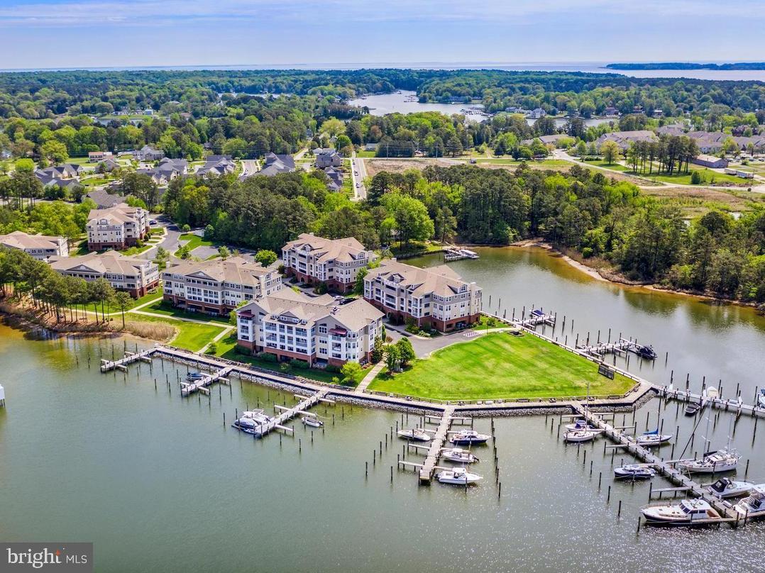 This place is like being on vacation every day!!!  Top floor 2BR 2FB waterfront condo with amazing views of Back Creek and Solomons Island in the Oyster Bay community.  The kitchen, dining and living room areas all share an open floor plan and vaulted ceilings.  The kitchen offers granite counters, stainless appliances, pantry and breakfast bar.  The dining room is surrounded by windows and the living room provides a corner fireplace.  Off of the living room is a large balcony with storage closet offering an outdoor living area to relax and enjoy the views and sunsets.  Stacked washer/dryer in unit.  In the under building garage area is one assigned parking spot and a storage locker, both convenient to the building elevator and mail boxes.  Additional parking is available in the parking lot.  A deepwater slip on pier C is also included with the lease.  Community amenities include the clubhouse, gym, pool, tennis/pickleball courts, waterfront promenade, boat slip piers and kayak launch.   The location is very convenient to the amenities offered in Solomons Island, Lex Park, Lusby and points beyond.   The property conveys partially furnished, but furniture (some or all) can be removed if arranged prior to lease and occupancy.  Owner pays HOA fees.  Pets case-by-case basis.