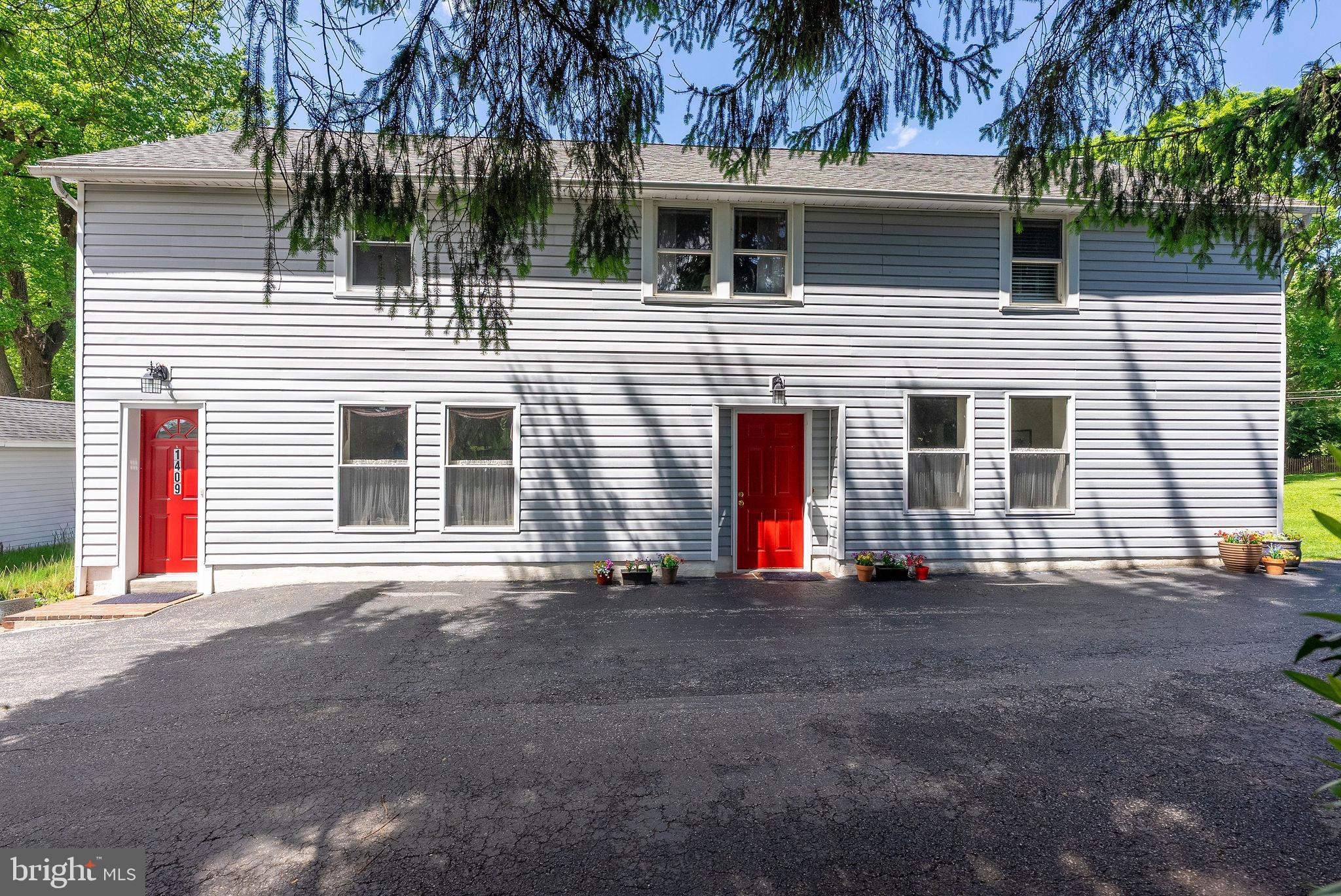 This charming and well-maintained home overlooks green pastures and mature trees in the highly desirable Falls Road Corridor! Featuring large, spacious rooms and a flexible layout, this home provides endless possibilities for comfortable living and entertaining. Originally built as a garage with an apartment above, the current owner has thoughtfully converted the lower level into wonderful living space with plenty of room for entertaining family and friends. The upper level features a great flow, charming hardwood floors throughout, a spacious family room, separate dining room, two bedrooms, and a full bathroom. The recently updated kitchen includes new countertops and stainless-steel appliances. The lower level includes a second family room with an extra-large storage closet, a lovely great room that leads to the beautiful deck and patio, and a third bedroom currently being used as an office. You will also find a large half bathroom that could potentially be converted into a full bathroom, along with a generous laundry/utility room and excellent closet and storage space. One of the best parts of 1409 Broadway is the backyard oasis, featuring a covered deck, flagstone patio, stunning landscaping, and beautiful greenery. The large storage shed was previously a one-car garage and could be converted back with the proper garage door. RECENT UPDATES INCLUDE: roof 2021, kitchen 2021, well pump 2023, water heater 2019, and HVAC 2011 which has been maintained twice a year since installation. This fantastic location is just minutes from I-695, I-83, local shopping, and everyday conveniences!