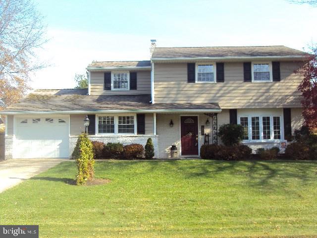 Stunning home - outside and in! 1st floor has a beautiful kitchen with island, large dining room with slider to 10x28 deck (partially covered), living room, large family room with 1/2 bath, and laundry/mud room off garage. Four nice size bedrooms and beautiful bath on 2nd floor. Unfinished basement. Gorgeous yard with deck, patio, and large ornamental pond. This is a wonderful home!