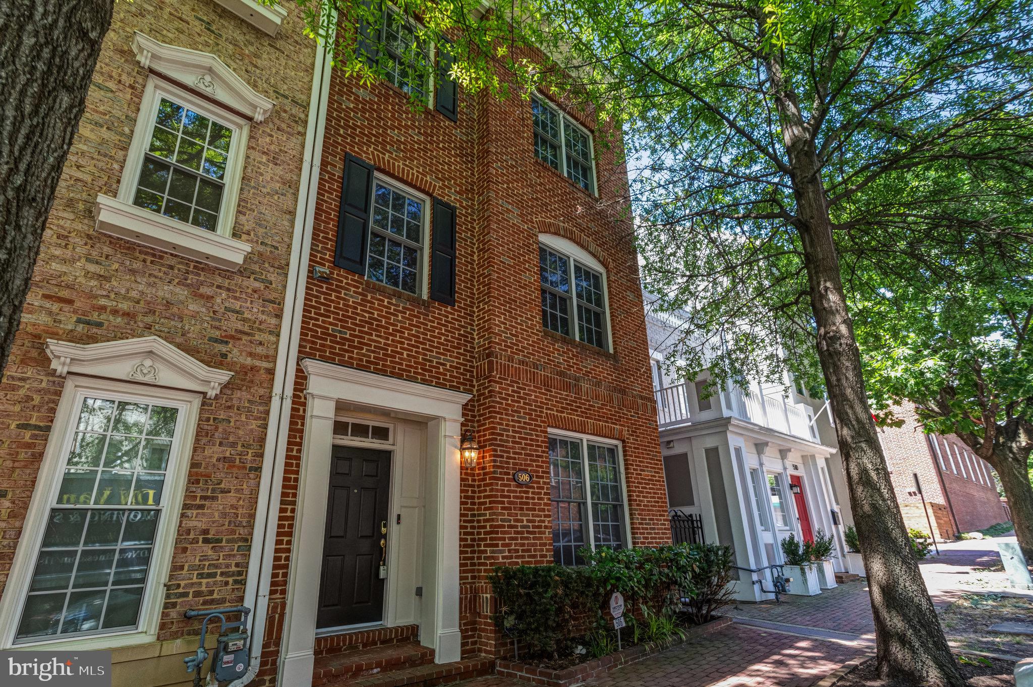 Welcome to 506 Pendleton Street in sought after Old Town Alexandria, Virginia! Beautiful 3 Bedroom/3.5 bath, all brick end unit townhome.  Upon entering the home you will be in the living room which boasts brand new hardwood floors through out the main level to include the dining room and kitchen area.  Gourmet kitchen offers brand new upgraded Kitchen Aid stainless steel appliances. granite counter tops, 5 burner gas cook top, kitchen island with double sink, pantry, entry to the backyard and rear detached 2 car garage.  Have the option of making a seating area or breakfast room while enjoying the gas fireplace right off the sun filled kitchen.  Upper level 1 of the home has the primary bedroom with ensuite primary bath.  Primary bedroom has brand new wall to wall carpet.  Primary bath has a soaking tub, double vanity and walk in shower.  Upper Level 1 hallway has wood flooring along with a laundry room and room with hardwood floors which can be used as an office or bonus room.  Leading up to the Upper Level 2 you will find Bedroom 2 and Bedroom 3, both with wall to wall carpet and ensuite bathrooms.  Hall area has a sitting area with wood flooring and this top level has its own Heating and Air Conditioning Zone.  Main Level and Upper Level 1 share the same heating and air conditioning zone.  Interior of the home has been freshly painted.  Wood blinds throughout entirety of the home.  Roofing on the home and the detached garage replaced in 2019. Two zone HVAC system replaced in the last 10 years.  Hot Water Heater replaced in the last 2 years.  All new insulation in the attic of the house in 2019.  Additional large semi finished storage area which spans the entire top of the detached garage, accessible via pull down ladder inside the garage.