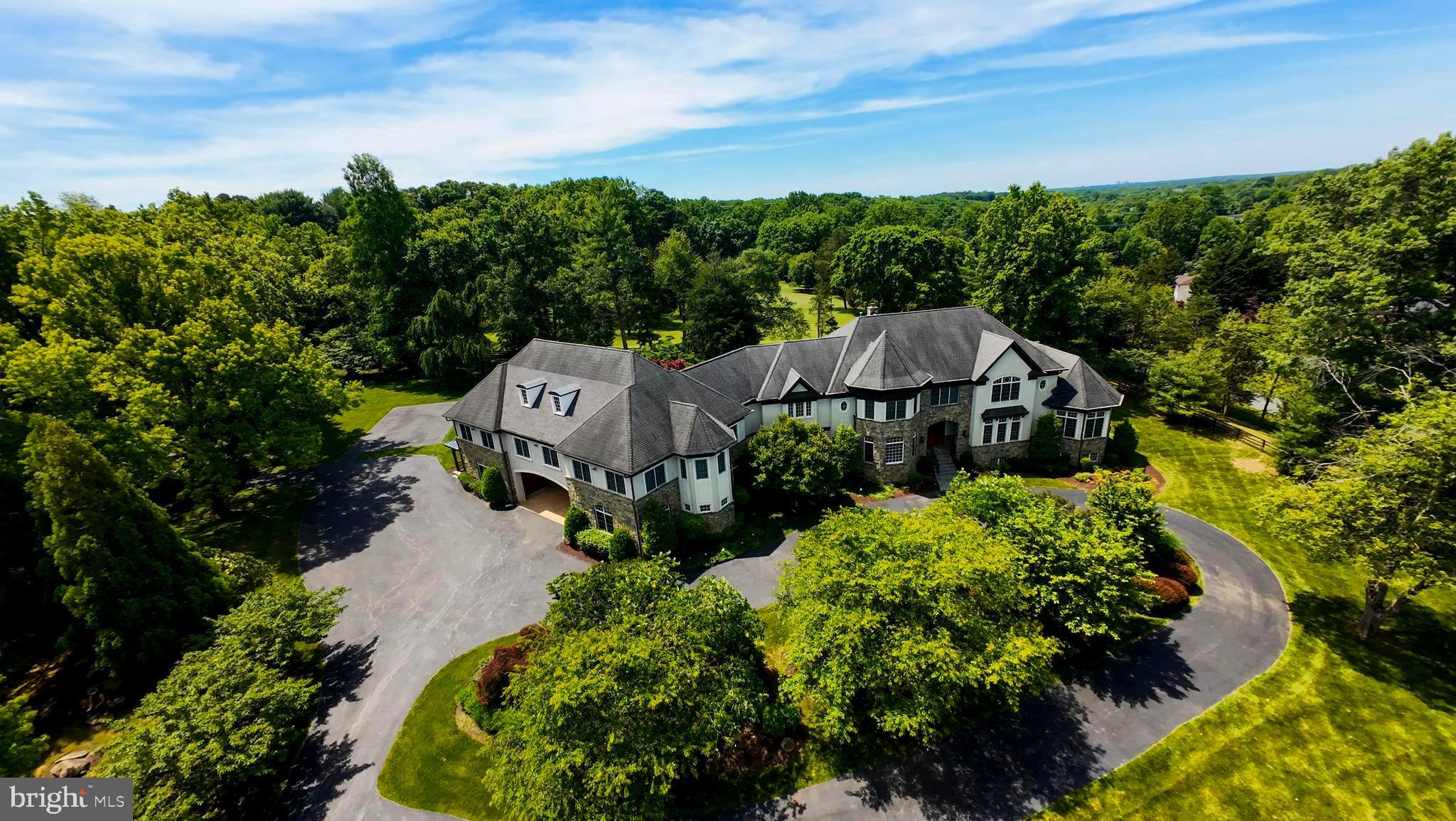 Nestled on a serene and private gated 4 acre homesite, this stunning custom masterpiece with over 16,000 Sqft of living space and a 6 car garage boasts unparalleled quality and detail throughout***
The impressive 2 story family room and conservatory with gorgeous wood beams highlight how impressive and unique this home truly is***The custom gourmet kitchen showcases a huge center island, top of the line appliances and upgraded cabinetry***The upstairs features 5 spacious bedroom and an owners suite with grand bath and 2 walk-in closets***The lower level is fully finished featuring 2 wonderful entertaining areas, a wine grotto, Theatre room and walkout access leading to a breathtaking back yard perfect for relaxing or entertaining***
Dont miss out on the amazing guest house over the garage with over 3,000 sqft of living space***Conveniently located to Potomac Village dont miss the chance to experience the epitome of luxury living in this remarkable home***
