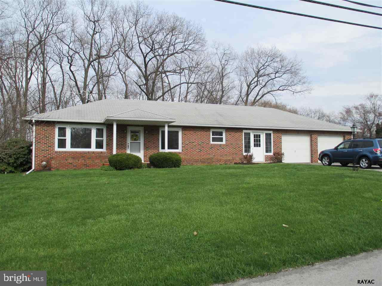 This all brick homes sits on 2.8 acres. Sit on your covered patio and enjoy the private backyard with trees, plus an invisible dog fence. The home has new windows with Low "E" glass and security film, hardwood floors, and a newer boiler. Freshened kitchen and bath that brightens the home. The breezeway has great air flow for spring and fall months.