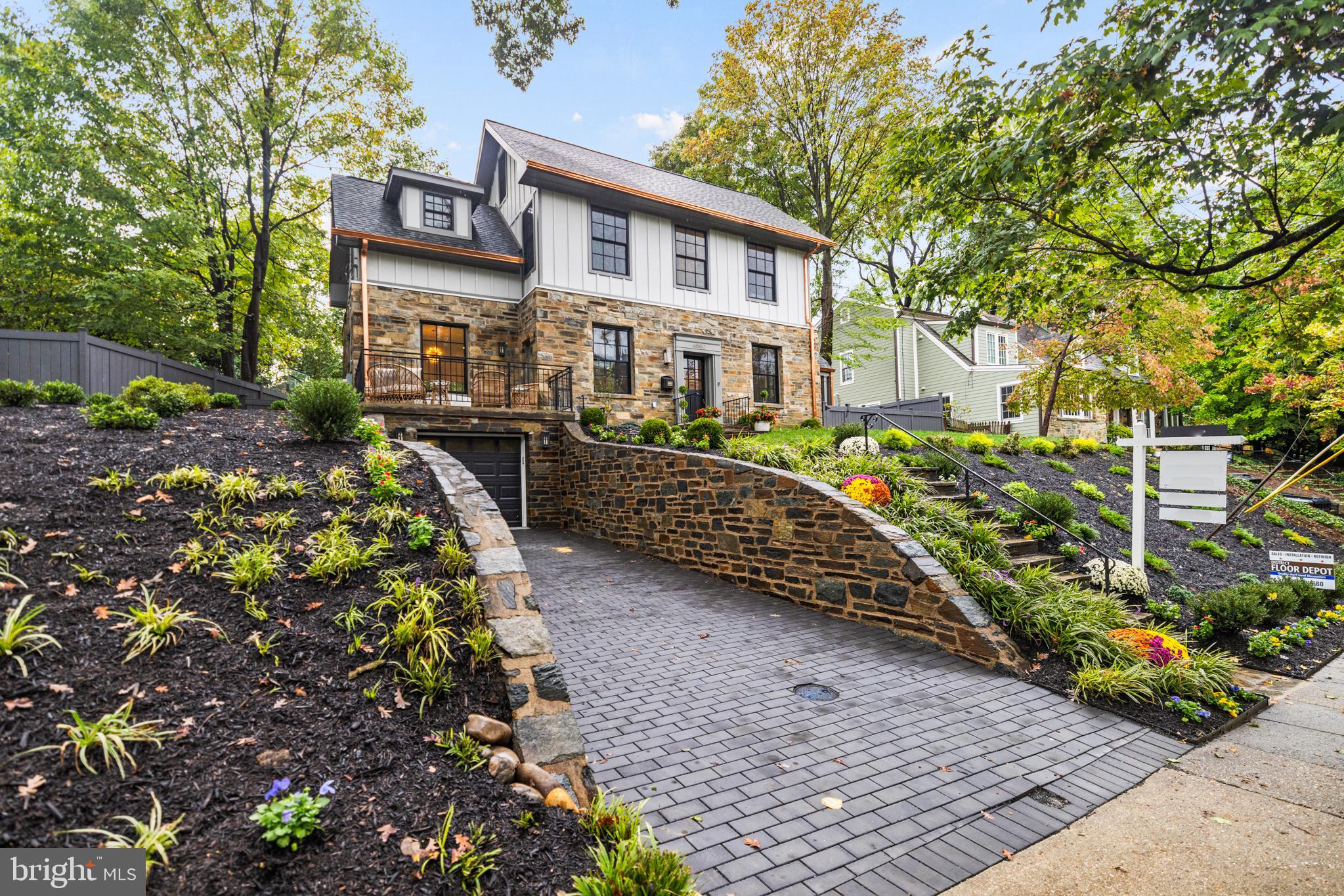 Built in 1938, this completely renovated residence maintains its original sensibility while offering a new and captivating interior.  The right amount of additional space has been seamlessly integrated into the existing house, with exterior finishes that are consonant with the period in which it was built.  Dilan Homes has transformed what was once a modest and dignified house into a luxurious home with spaces on three finished floors that were rationally and carefully considered, comprising more than 4,000 square feet.  The house occupies a handsome lot with an approach that is sited well above the street; a quiet space is found within. The main level claims attention immediately with its 10-foot ceilings and gracious floor plan.  The main living space, kitchen, and dining area are all inviting, affording the occupants an opportunity to entertain on a very generous scale.  The kitchen has been outfitted with a large pantry that may also serve as a prep area and space for small appliances.  Accessible from the kitchen is an original porch which has screens on all sides for maximum utility.  A library off the front hall can be used as a private sitting room, office, or space to entertain guests on a more intimate scale.  Found on this floor is a powder room, den, and balcony from which the view can be enjoyed in all seasons. The second level offers a spacious primary suite with a walk-in closet large enough to serve as a dressing room.  The second bedroom has an ensuite bathroom, generous closet, and a separate space which can be used as a den.  The third bedroom has also been created with an ensuite bathroom, making all three bedrooms equally well-planned and comfortable.  This level also has been outfitted with a separate laundry room and two linen closets. The lower level feels as comfortable as the upper two levels and offers a family room, bedroom with full bathroom, a second laundry, and entrance to the garage.  The garden has also been as thoughtfully considered as the rest of the house, with a flagstone terrace and new plantings framing the lot.