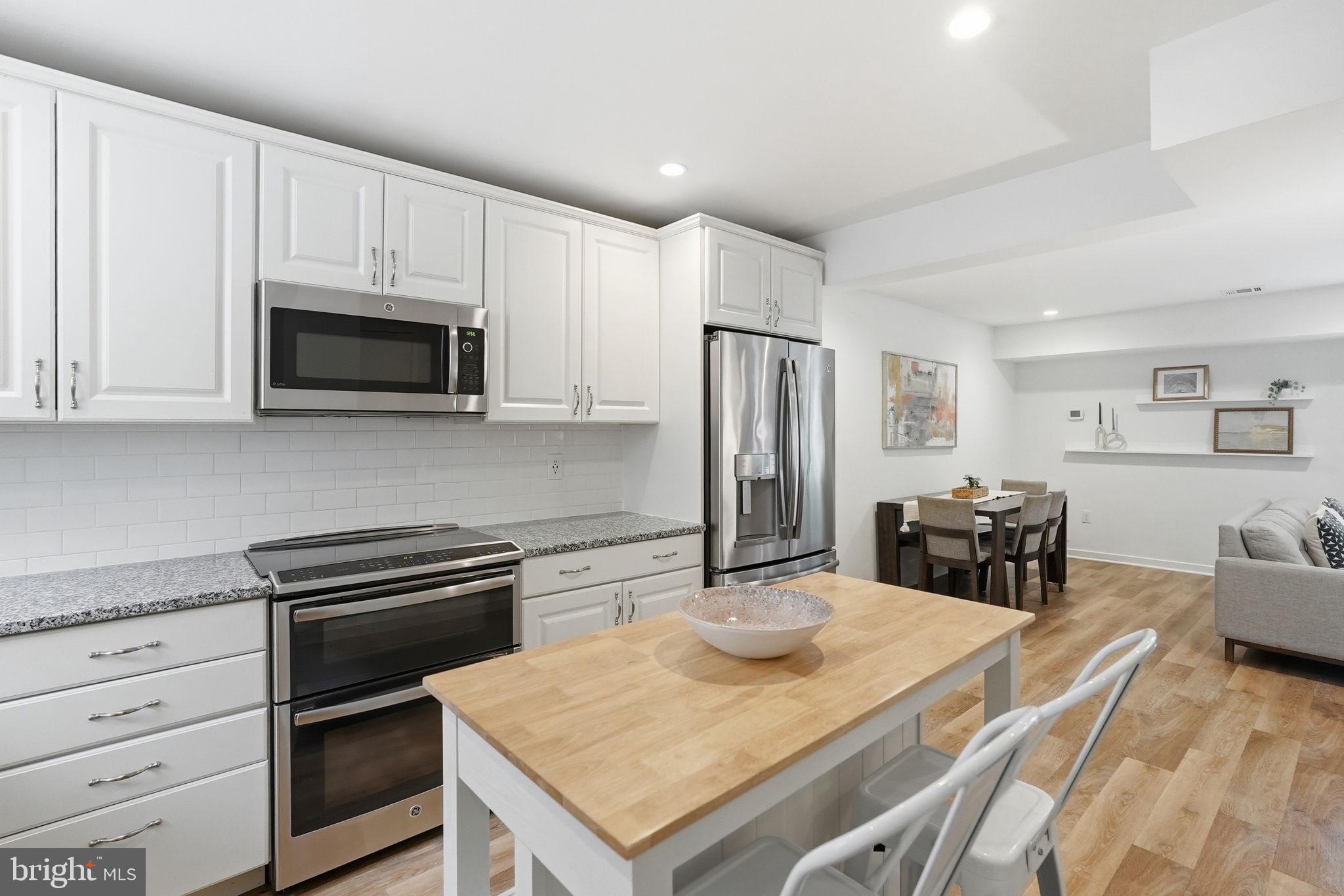 Set in the heart of downtown Bethesda, 8901 Battery Place #34 offers the rare appeal of a two-level condo with the comfort, privacy, and sense of separation often associated with a townhome. Thoughtfully updated and freshly finished, this charming residence combines an easy, livable layout with private outdoor space in one of Montgomery County’s most convenient and connected locations.

The main level is bright and welcoming, with an open living and dining area designed for both everyday ease and relaxed entertaining. A fireplace anchors the living room, creating a warm focal point, while direct access to the private rear patio extends the living space outdoors. The dining area offers a defined place to gather, and the updated kitchen is efficiently arranged with ample workspace and storage. A convenient powder room completes the main level, adding everyday functionality for residents and guests alike.

Upstairs, two comfortable bedrooms are thoughtfully positioned for privacy. The spacious primary bedroom offers generous proportions, while the secondary bedroom includes a walk-in closet, providing flexibility for guests, a home office, or additional storage. A tastefully updated full bathroom serves the upper level. New LVP flooring and electrical panel completed in 2026, and fresh paint throughout both levels give the home a clean, cohesive, move-in ready feel.

Perfectly positioned moments from the best of downtown Bethesda, this home offers exceptional access to Bethesda Row, neighborhood restaurants, cafés, boutiques, fitness studios, grocery stores, parks, and everyday conveniences. Both the Bethesda and Medical Center Metro stations are nearby, making commuting to Washington, DC, NIH, Walter Reed, and surrounding employment centers remarkably easy. With updated interiors, a private patio, in-unit laundry, abundant storage, a private parking space and llots of guest parking, and access to the highly sought-after Bethesda school cluster, this inviting home delivers a compelling blend of urban convenience, neighborhood charm, and low-maintenance living.


Public record reflects total square footage of 1,055. 
All measurements are approximate. Property details and square footage should be independently verified, and not used for property valuation.