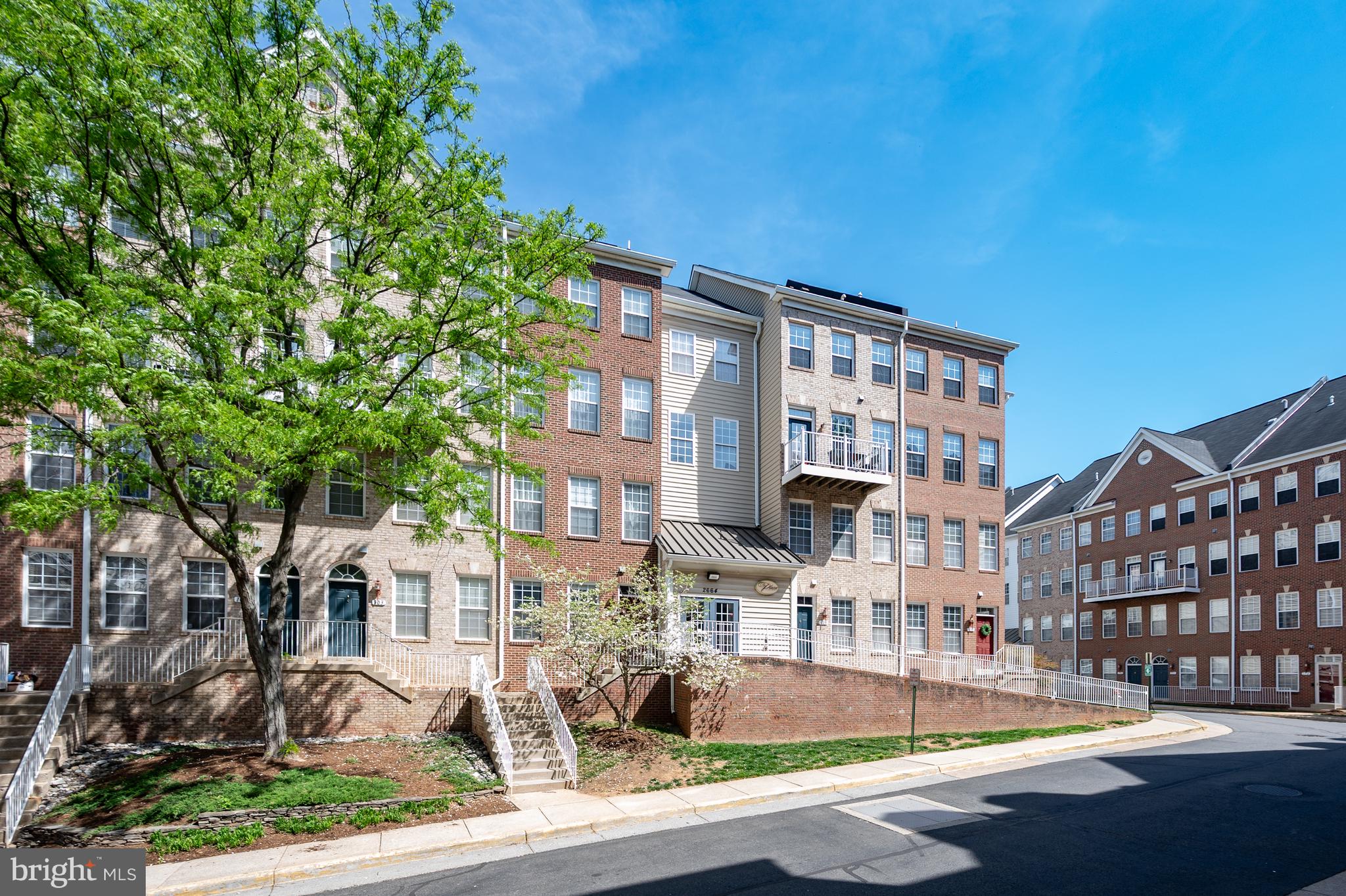 Lovely two-level condo in a fantastic location! Right across the street to Dunn Loring Metro, with additional shopping just a block away.  This unit comes with assigned garage parking and additional parking passes. This bright, spacious unit has plenty of windows providing natural light in every room. The entry opens to an open-concept kitchen and dining area that flows into a large carpeted living room with a gas fireplace. The second floor offers two bedrooms, each with a full bathroom and walk-in closets. A separate upper-level laundry room includes full-size washer and dryer units. The outdoor balcony overlooks a recreation center with a fitness room and party room. This unit is conveniently located in Merrifield near the Mosaic District with restaurants, grocery stores (Starbucks, Harris Teeter, Safeway, Mom’s Organic Market), Target, True Food Kitchen, movie theaters and entertainment venues, Merrifield Garden Center and just minutes from Tyson’s Corner and the I-495 beltway. Unit is being sold as-is.