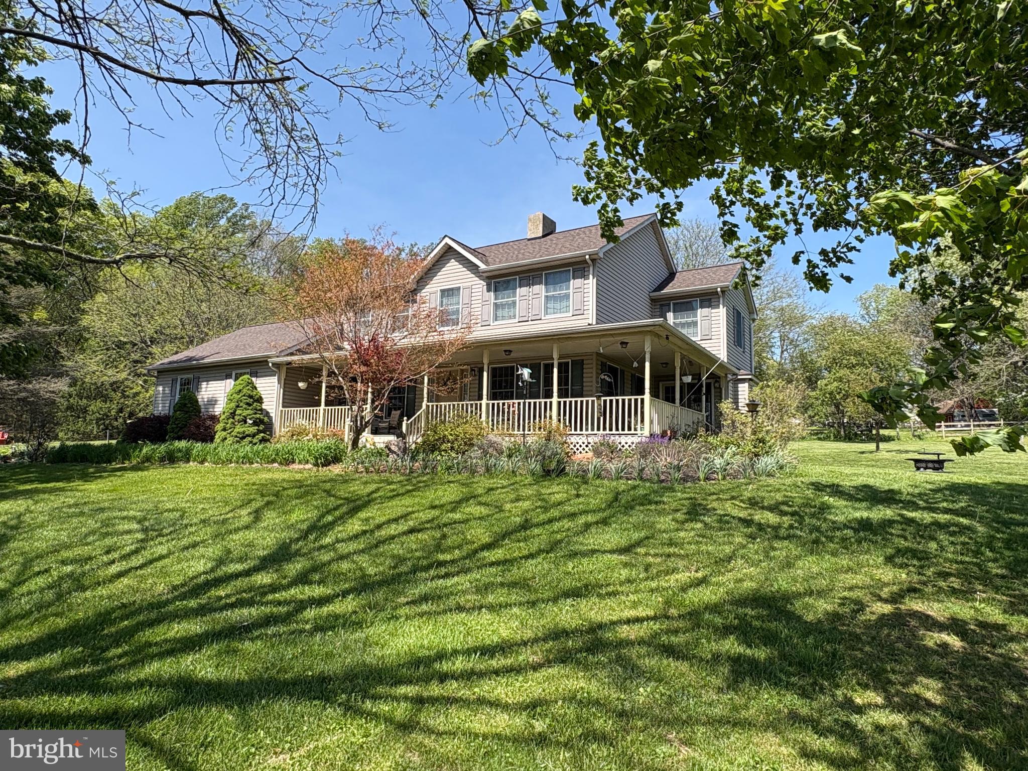 A rare opportunity to own over 10 breathtaking acres in the heart of Chester County's prestigious horse country. Set amidst the rolling countryside of East Fallowfield Township, this exceptional 11-acre equestrian estate offers a lifestyle rarely found in today's market. Combining beautifully usable acreage, thoughtfully designed horse pastures and a warm, inviting home, this is a rare opportunity to own one of the few available horse properties in one of Chester County's most desirable equestrian settings. The property's layout is truly exceptional. The gently rolling landscape provides beautifully usable pasture, established fencing, and ample space to add a future riding arena. The well-appointed two-stall barn features electric, water, and a dedicated tack room. Whether you're an experienced equestrian or simply dreaming of country living with room to roam, this property offers endless possibilities.  
Built in 1994, the home offers 2284 sf of thoughtfully designed, above-grade living space. Complemented by a full basement, full of possibilities, whether it's additional living space, a recreation room, fitness area, or workshop. 
Inside oversized windows fill the home with natural light and showcase picturesque views of the surrounding countryside. At the heart of home, the spacious kitchen is designed for everyday living and effortless entertaining, featuring beautiful solid wood cabinetry, generous prep space, abundant storage, and a double oven that makes hosting family and friends a pleasure. 
The primary suite serves as a peaceful retreat with a walk-in closet and a private ensuite complete with a soaking tub and separate walk-in shower. Two additional bedrooms share a full hall bath, while a conveniently located powder room serves guests, bringing the home's total to two full bathrooms and one half bath.
Step outside to the expansive wraparound porch and experience on the home's most unforgettable features. Whether you're enjoying your morning coffee as the sun  rises over the fields or relaxing at the end of the day while taking in the panoramic countryside views, this is a place where you will naturally slow down and be able to appreciate the beauty around you. Mature trees frame the property, enhancing both its privacy and timeless charm. 
A long paved driveway creates a welcoming approach to the home and attached 2-car garage, reinforcing the peaceful, estate-like setting. While you'll enjoy the tranquility of country living, you're still conveniently located just minutes from shopping, dining, parks and major commuter routes. 
Horse properties offering this combination of usable acreage, functional equestrian amenities, scenic beauty, and convenient location are becoming increasingly rare in Chester County. Whether you are seeking a private equestrian retreat, a family homestead, or simply a place where open space and breathtaking views become part of everyday life, this exceptional property offers a lifestyle that is increasingly difficult to find - and impossible to forget.
