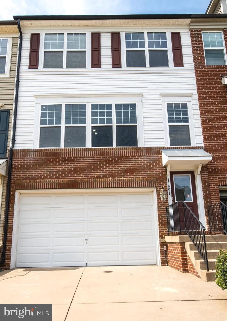 Welcome to 11801 Lake Baldwin Dr, a stunning 3-bedroom townhome in the heart of Bristow, VA. This beautifully designed home features 2 full and 2 half bathrooms, a spacious floor plan, and luxurious finishes.
Step inside to discover gleaming hardwood floors, a gourmet kitchen with stainless steel appliances and granite countertops, and bright, open living spaces perfect for relaxing or entertaining. 
The primary suite offers 2  generous walk-in closets and a luxurious bathroom.
The finished lower level provides extra living space, perfect for a home office, playroom, or lounge. It has walk-out access to the fenced-in patio. Enjoy the convenience of a 2-car garage, low-maintenance living, and access to local amenities and commuter options!