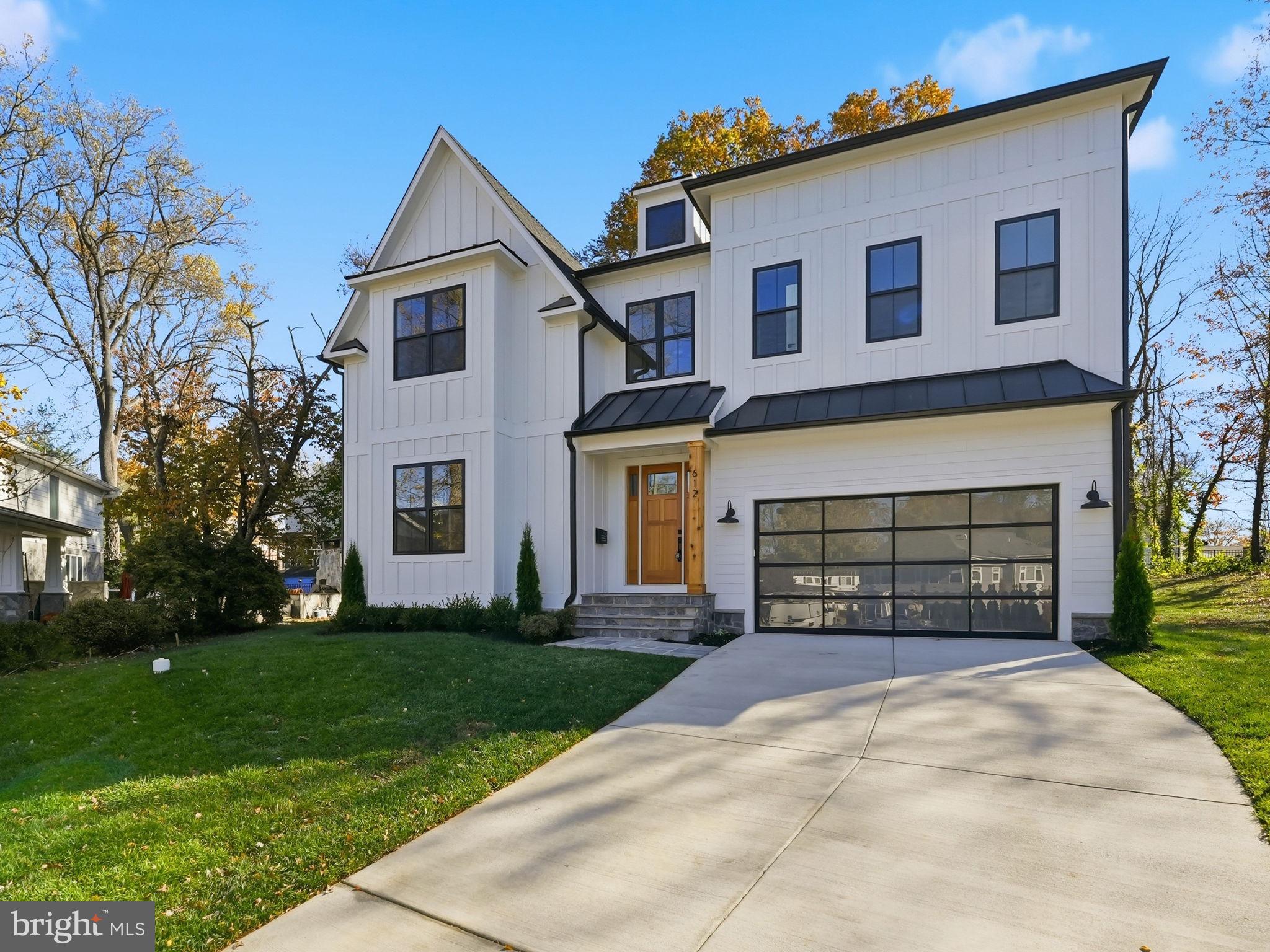 Welcome to this stunning brand new Modern Craftsman home, perfectly situated at the end of a quiet cul-de-sac in Vienna. Spanning over 5,000 sq ft across three finished levels, this home offers 6 bedrooms, 6.5 baths, and a spacious two-car garage.

Step onto the covered flagstone front porch with distinctive metal roof accents and enter a grand two-story foyer. Enjoy wide-plank white oak flooring throughout the home. The main level features a flexible bedroom or dedicated office with a full bath, ideal for guests or remote work.

The heart of the home is the open-concept gourmet kitchen and family room, complete with a cozy gas fireplace. The chef’s kitchen boasts a large waterfall island, top-of-the-line 48" Monogram appliances, pot filler over the gas stove, two dishwashers, prep sink, and a walk-in pantry. The spacious mudroom featuring a built-in bench with cubbies, and a convenient half bath; offers everyday functionality.

On the upper level, you’ll find four en-suite bedrooms, including a luxurious primary suite with dual walk-in closets. The spa-inspired primary bath features a wet room with dual rain shower heads and a soaking tub, plus a dual vanity. A spacious upper-level laundry room adds convenience.

The walk-up lower level is perfect for entertaining with a media room, an additional en-suite bedroom, a large rec room, and a wet bar with beverage center. Multi-sliding patio doors lead to the covered TimberTech deck with Impression Rail System, ideal for indoor-outdoor living.

Additional highlights include a dual-zone HVAC system, tankless water heater, Andersen windows, and an architectural shingle roof. Located in the highly sought after Marshall/Thoreau/Madison school pyramid and close to shopping, dining, and parks, this home truly has it all. Come check this beautiful home out for yourself!
